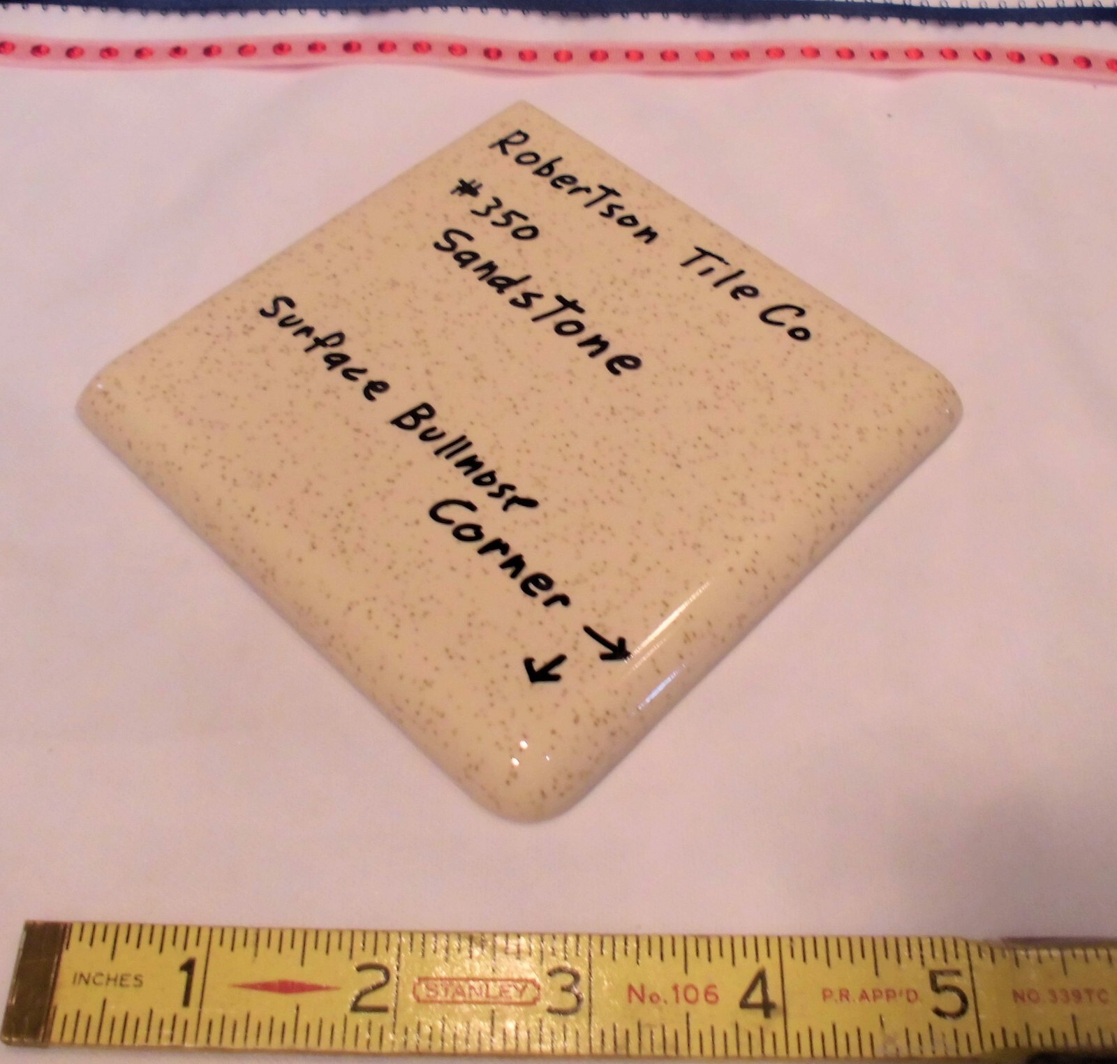 1 pc. Sandstone / Buckwheat: Glossy Ceramic Corner Bullnose Tile by Robertson Co