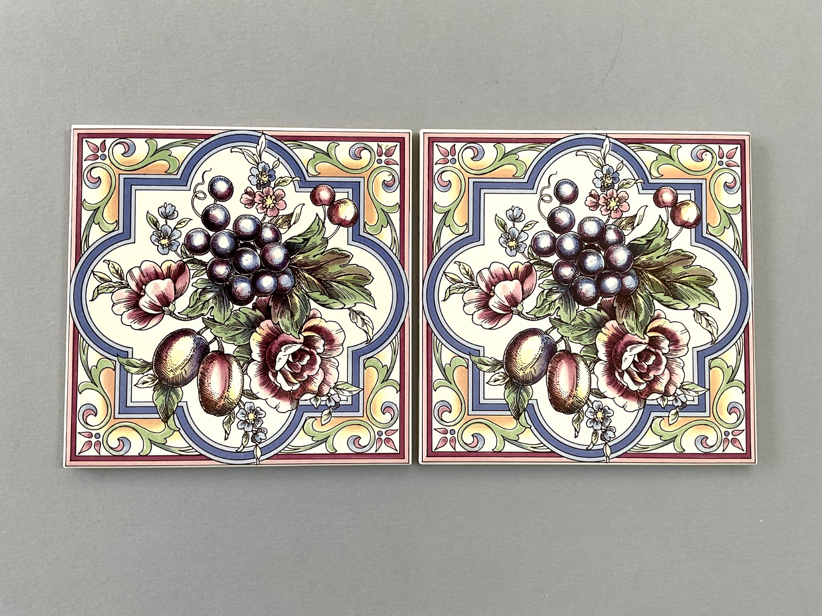 A Pair of Ceramic Tiles/Trivets with Floral and Fruit Pattern 5 7/8″ x 5 7/8″