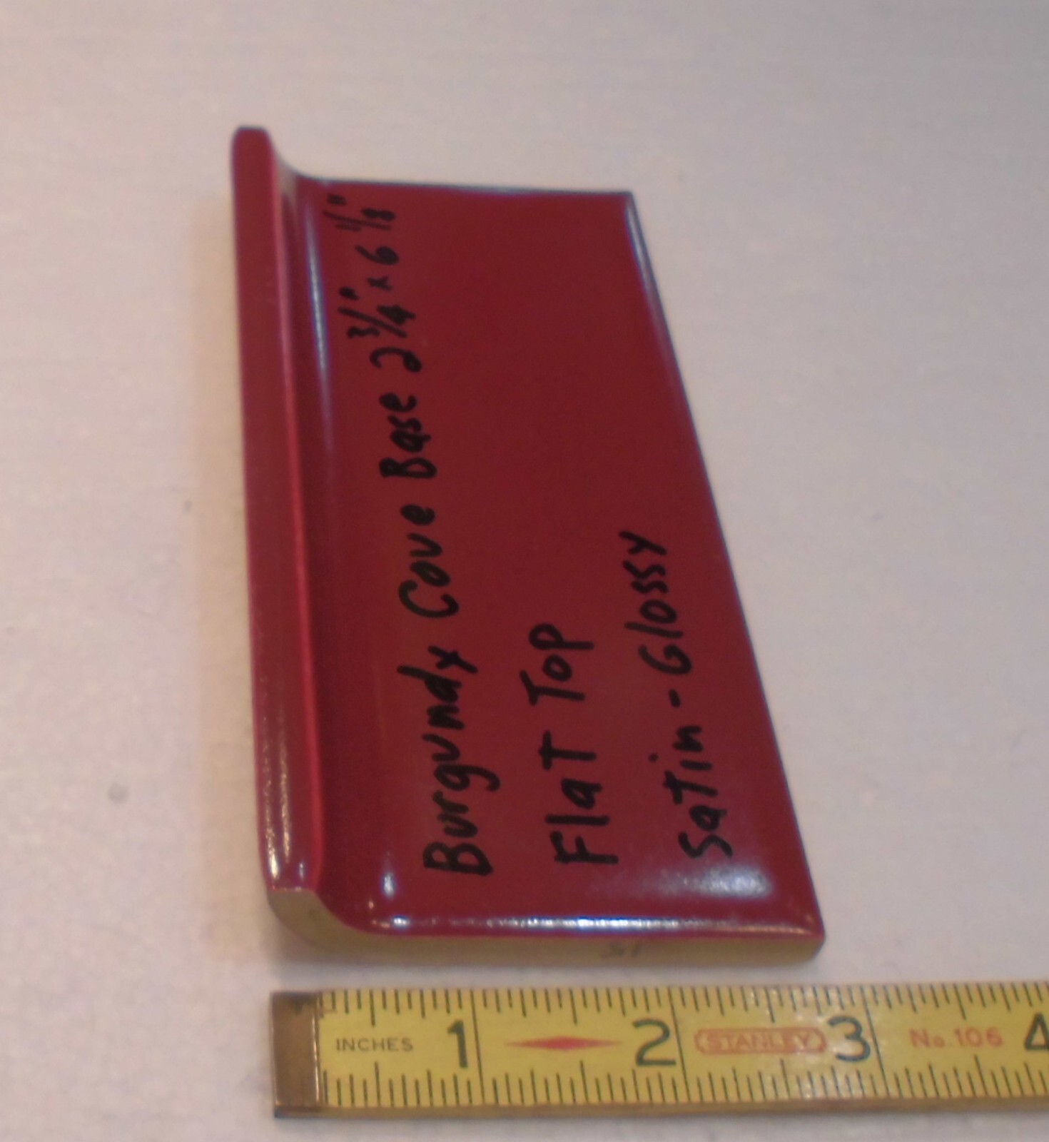 1 pc. Satin Gloss Burgundy: Flat Top base/cove Ceramic Tile: 2-3/4″ X 6-1/8″
