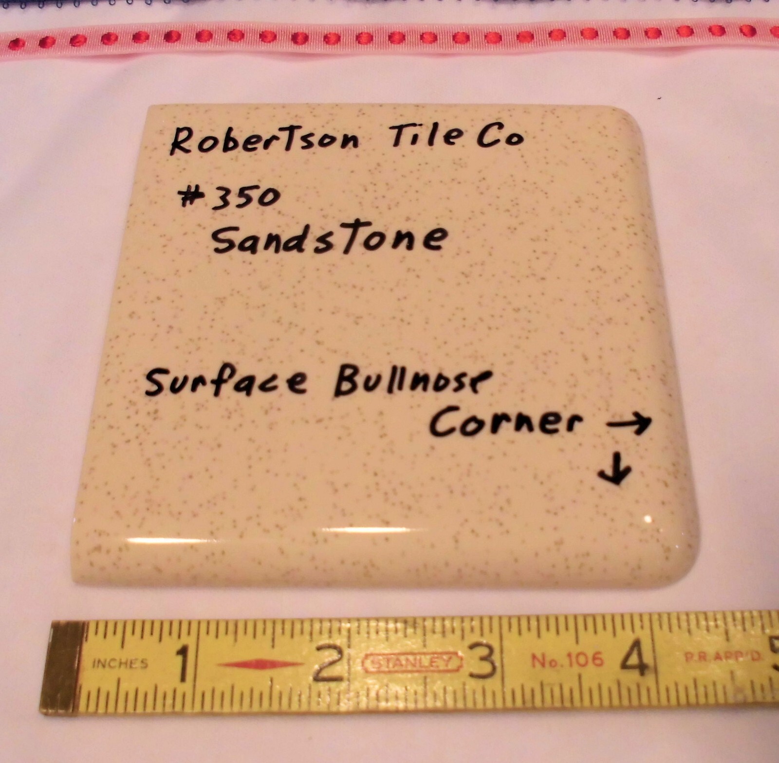 1 pc. Sandstone / Buckwheat: Glossy Ceramic Corner Bullnose Tile by Robertson Co