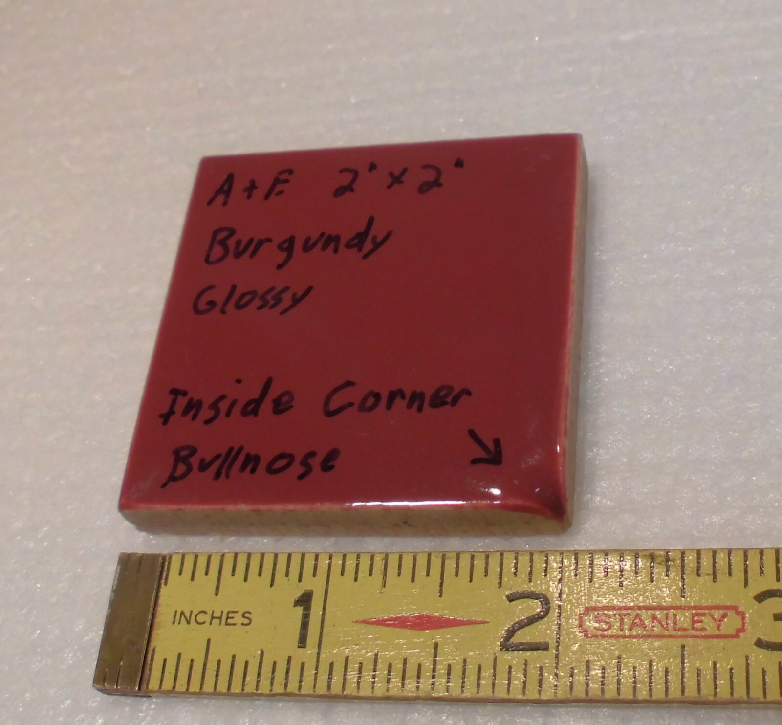 Burgundy 2″ X 2″ X 5/16″ Ceramic Surface Bullnose Inside Corner Tile; 1950’s