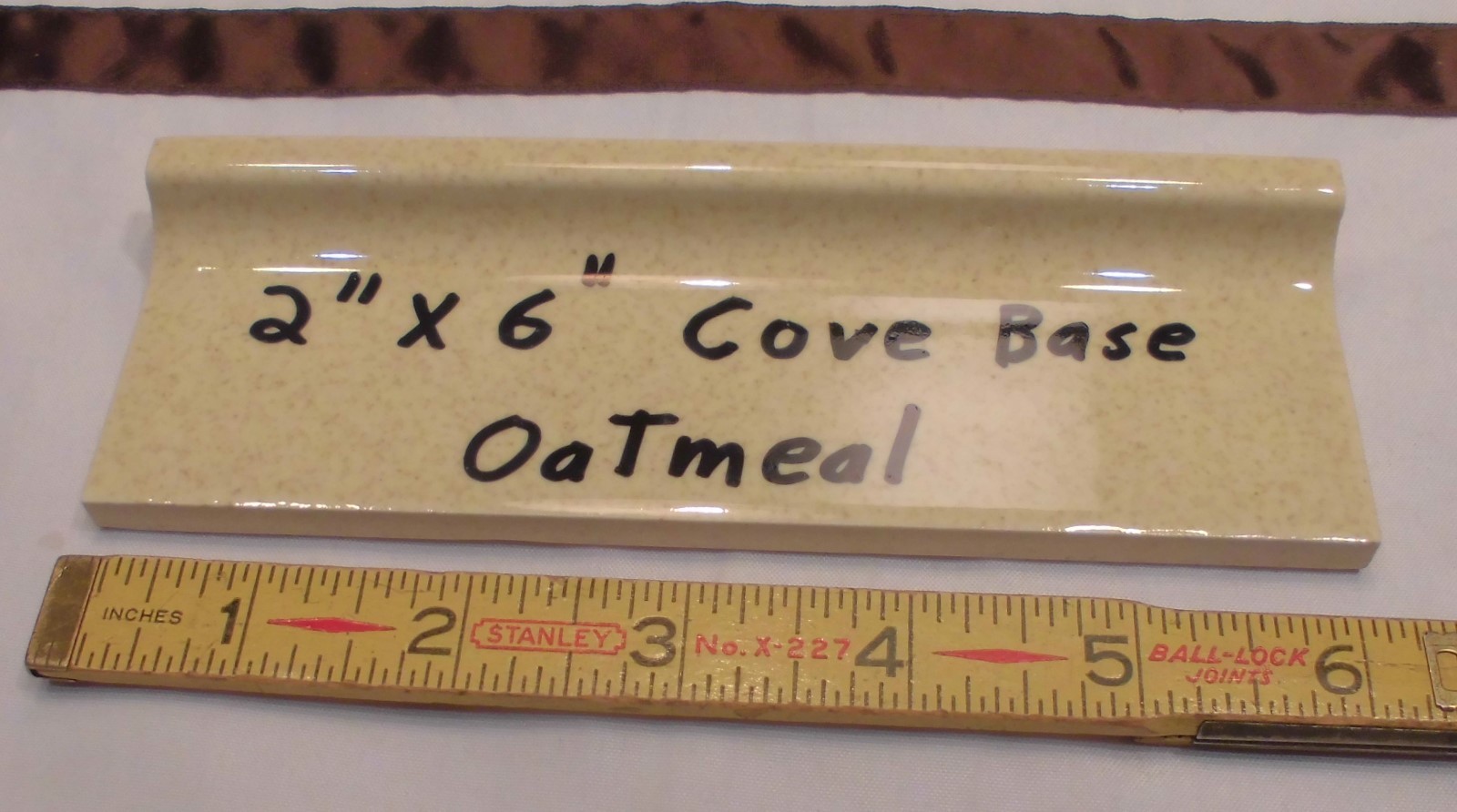 1 pc. Oatmeal – Yellow Speckled; stack-on-top base/cove Ceramic Tile 2″ X 6″
