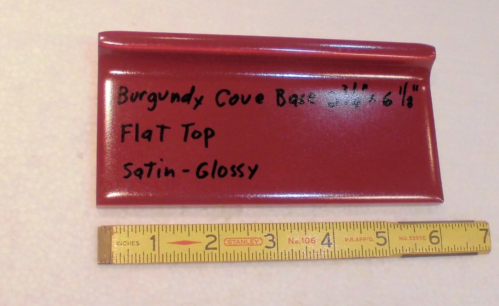 1 pc. Satin Gloss Burgundy: Flat Top base/cove Ceramic Tile: 2-3/4″ X 6-1/8″