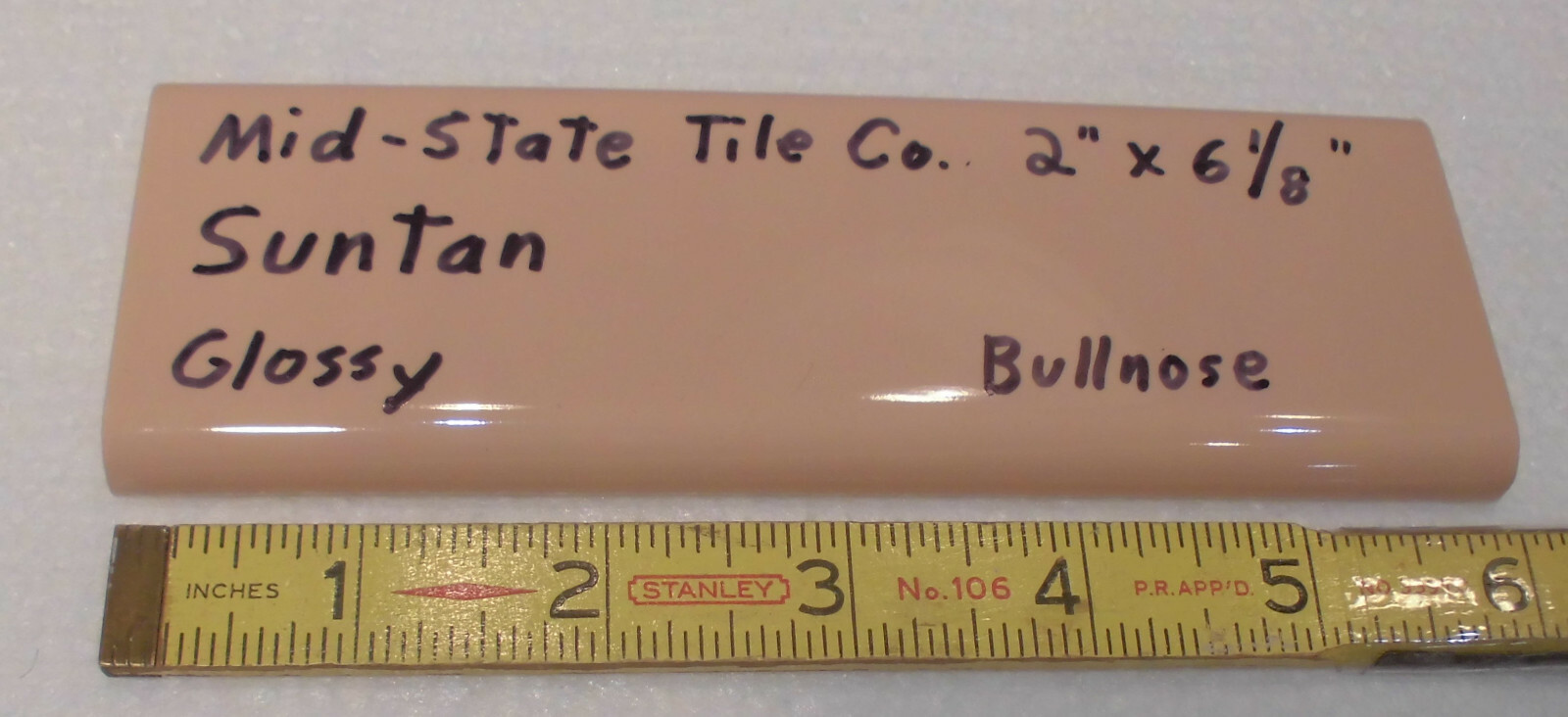 1 pc. Suntan-Beige 2” X 6” Glossy Ceramic Surface Bullnose tile by Mid-State Co.