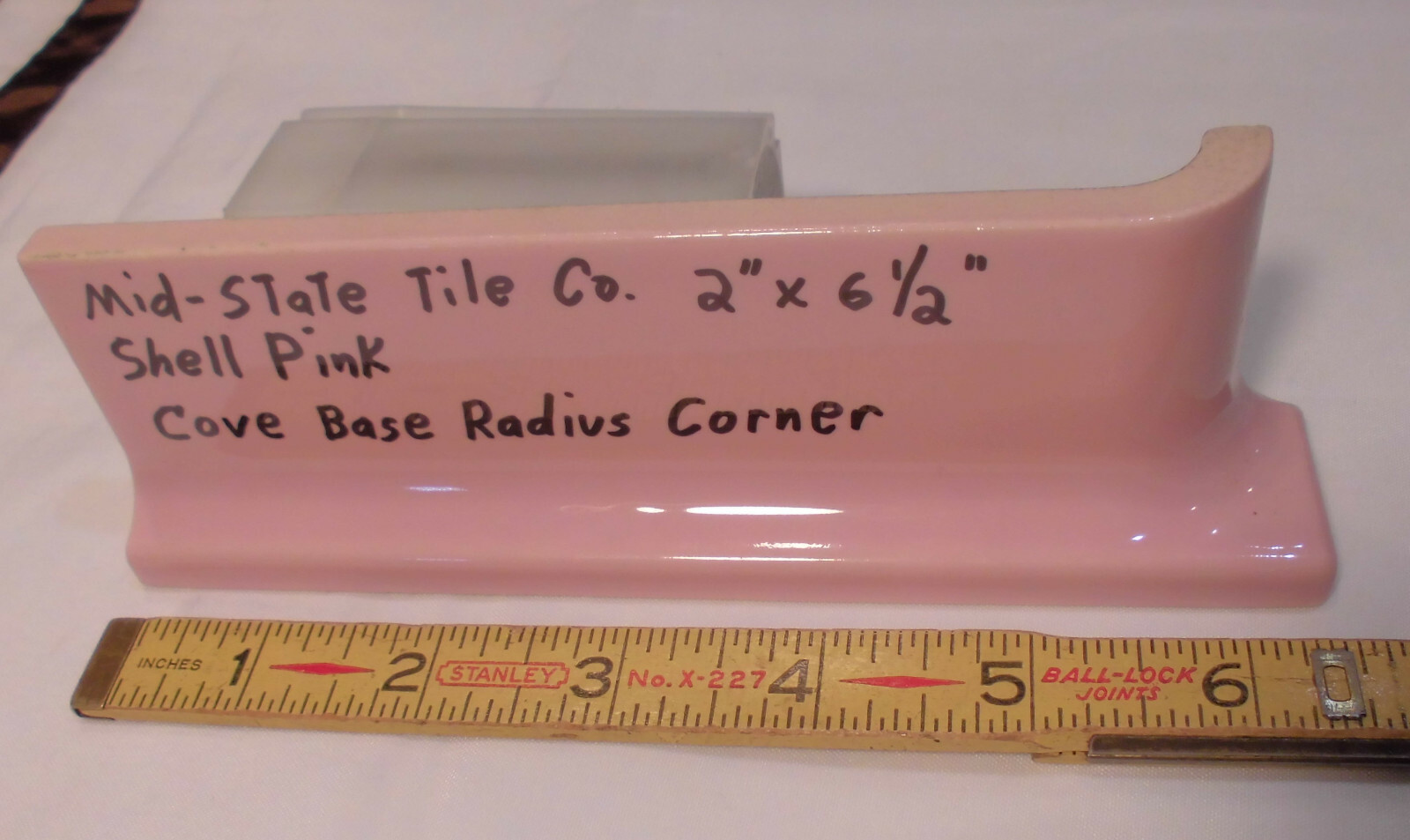 1 pc. Glossy Shell Pink 2” X 6-1/2” Ceramic Radius Cove Base Tile; Flat Top, R