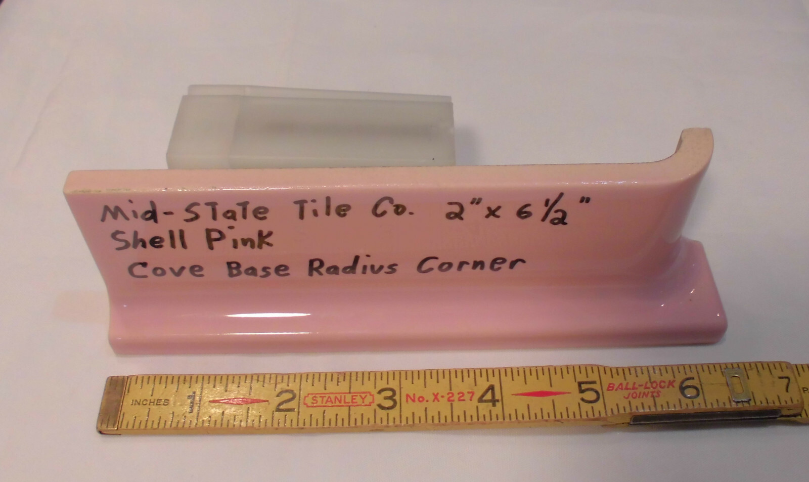 1 pc. Glossy Shell Pink 2” X 6-1/2” Ceramic Radius Cove Base Tile; Flat Top, R