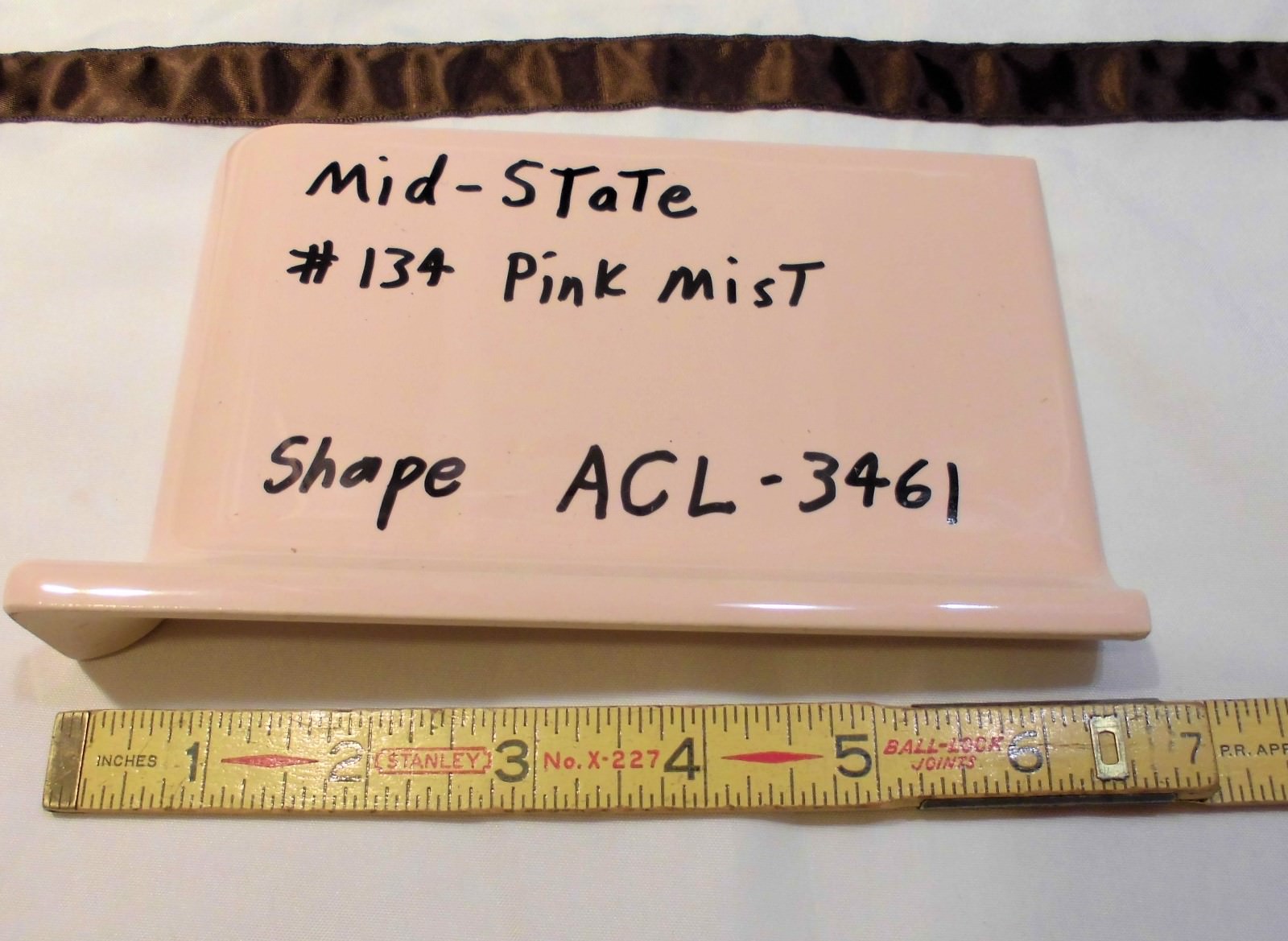 1 pc. Glossy *Pink Mist* 4” X 6” Ceramic Cove Base Outside Corner Tile-stack top