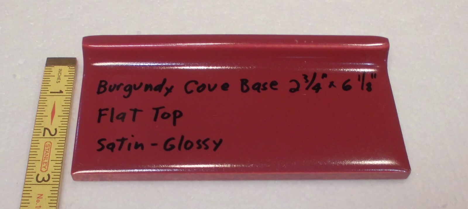 1 pc. Satin Gloss Burgundy: Flat Top base/cove Ceramic Tile: 2-3/4″ X 6-1/8″