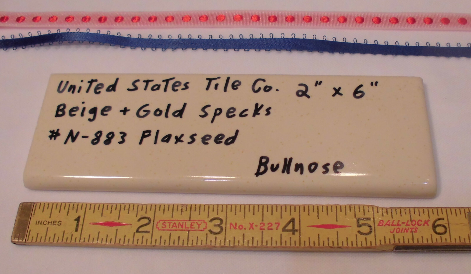1 pc. Flaxseed / Beige + Gold Specks; Glossy Bullnose Surface Flat Ceramic Tile