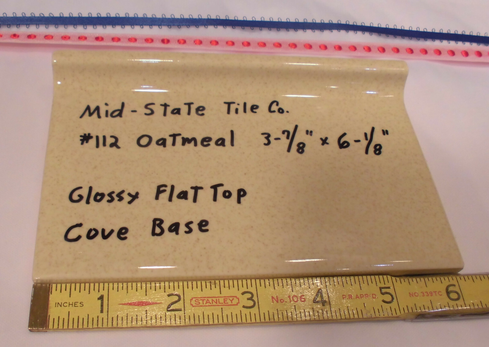 1 pc. Glossy *Oatmeal* 4” X 6” Ceramic Cove Base Tile by Mid-State, flat top