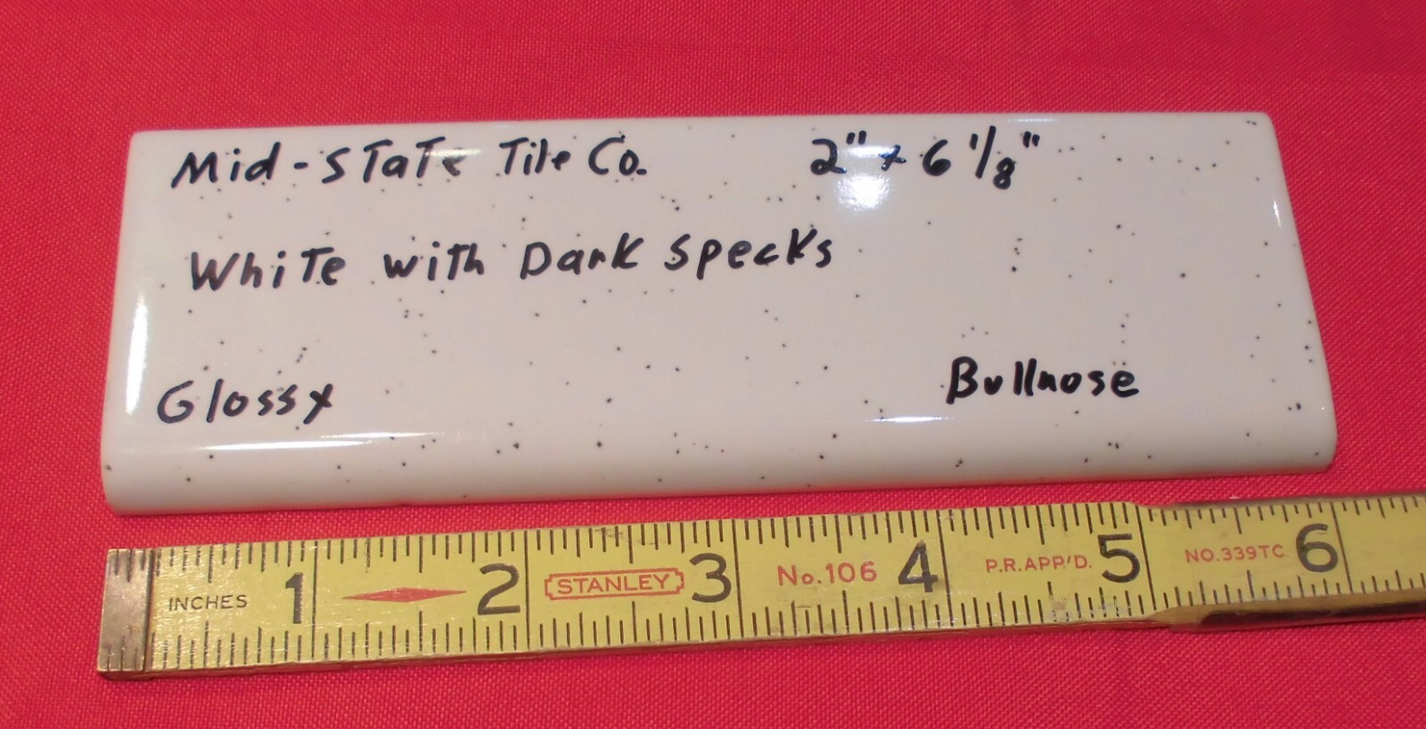 1 pc. White + Dark Specks: 2” X 6” Surface Bullnose Ceramic Tile by MID-STATE