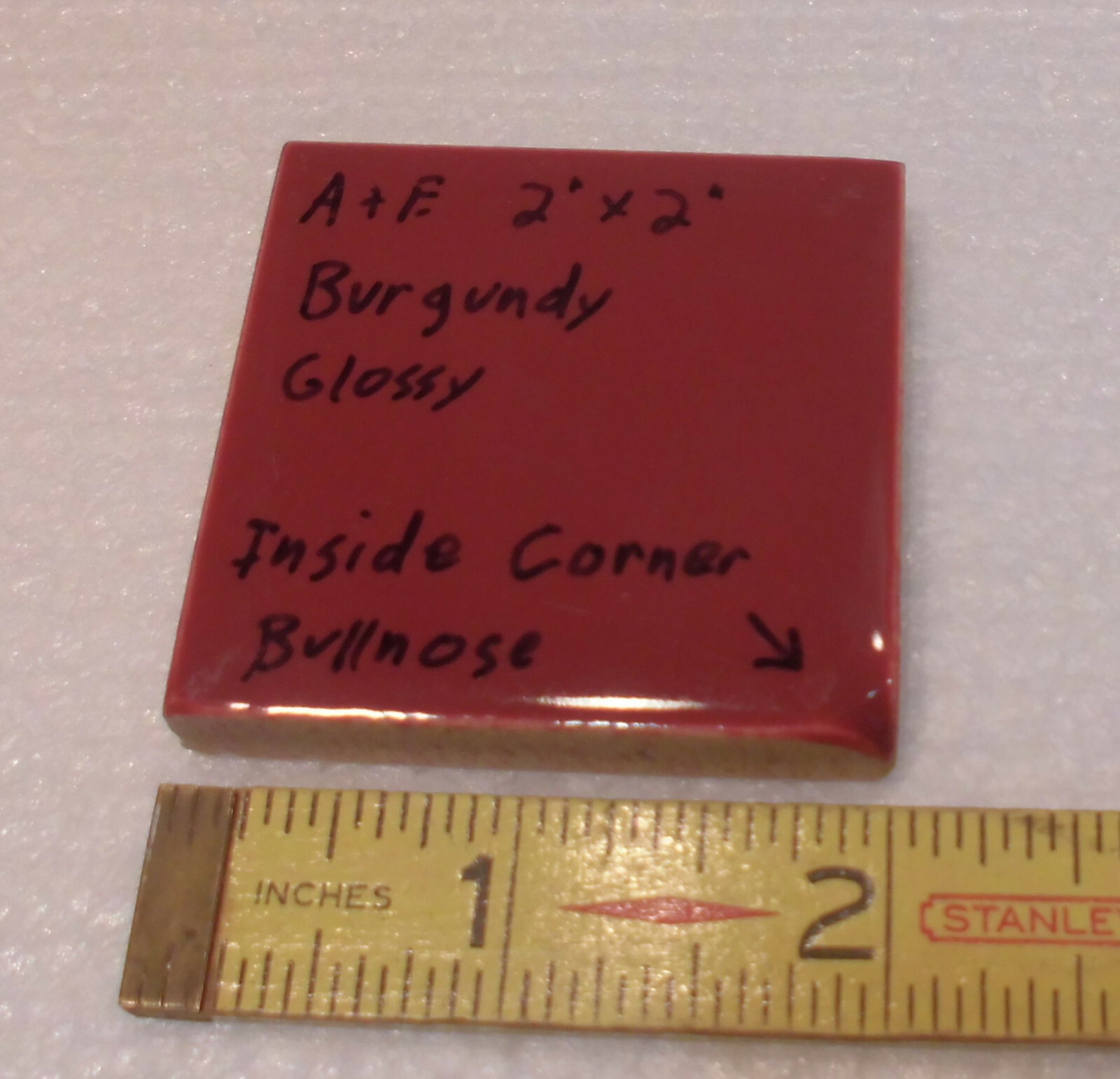 Burgundy 2″ X 2″ X 5/16″ Ceramic Surface Bullnose Inside Corner Tile; 1950’s