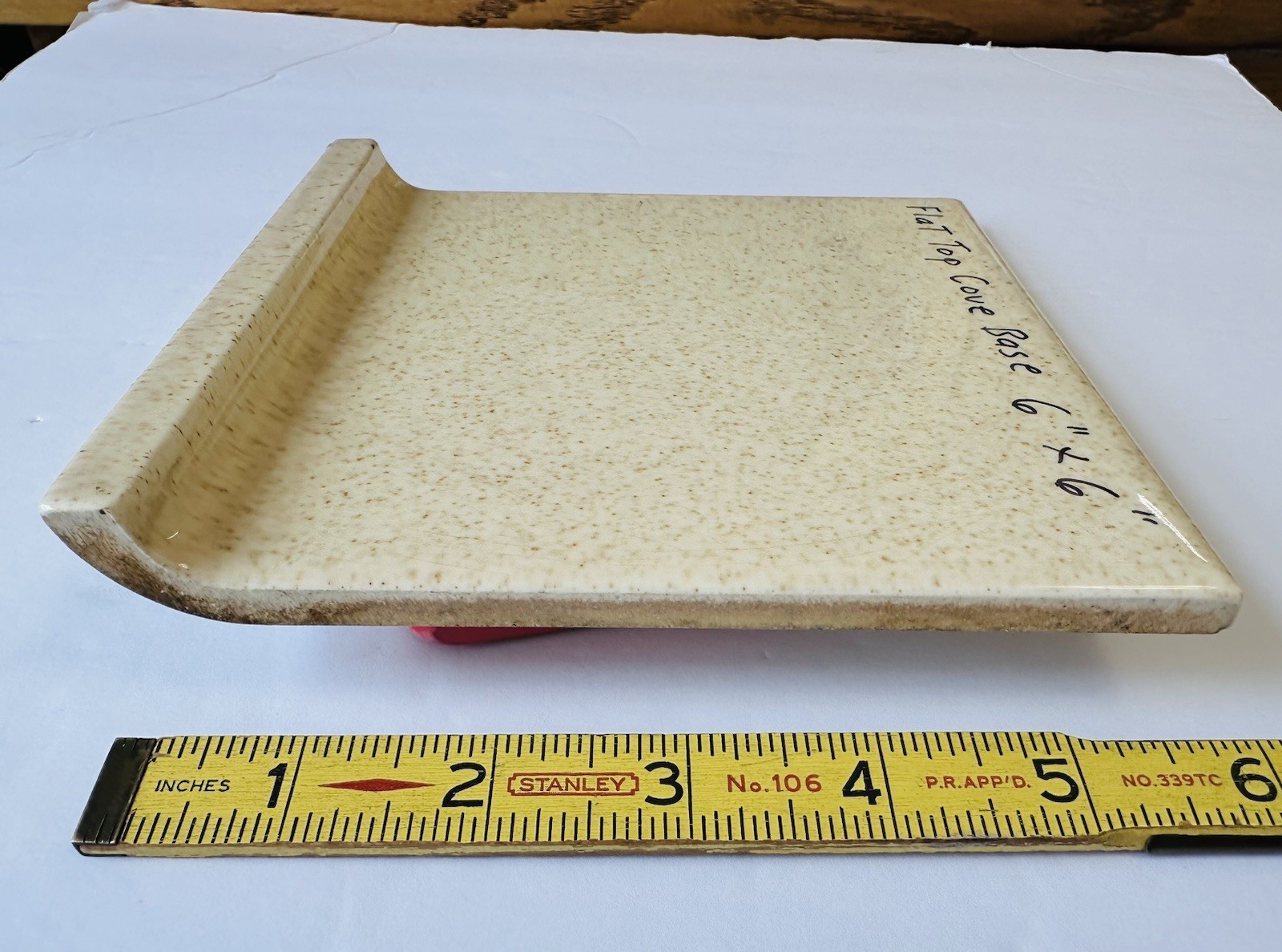1 pc. Oatmeal Speckled Color: 6” X 6” Glossy Ceramic Cove Base Tile