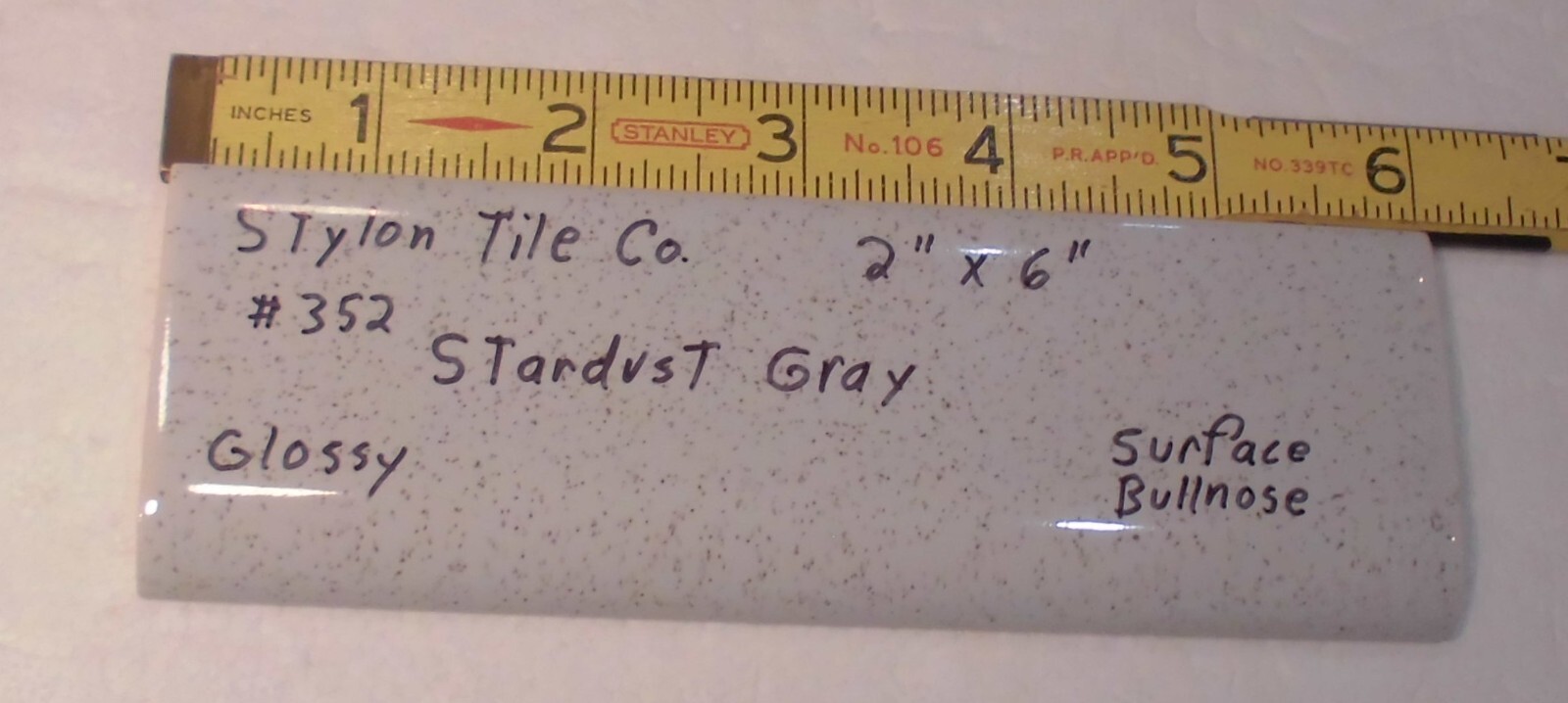 1 pc. Stardust Gray: 2” X 6” Speckled Glossy Bullnose Ceramic Tile, Stylon, Used