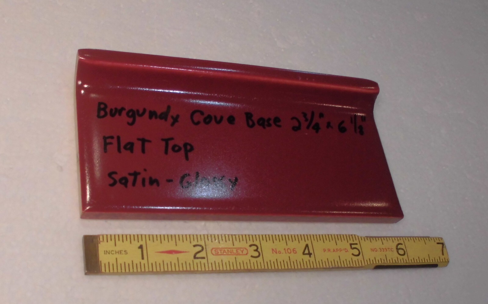 1 pc. Satin Gloss Burgundy: Flat Top base/cove Ceramic Tile: 2-3/4″ X 6-1/8″