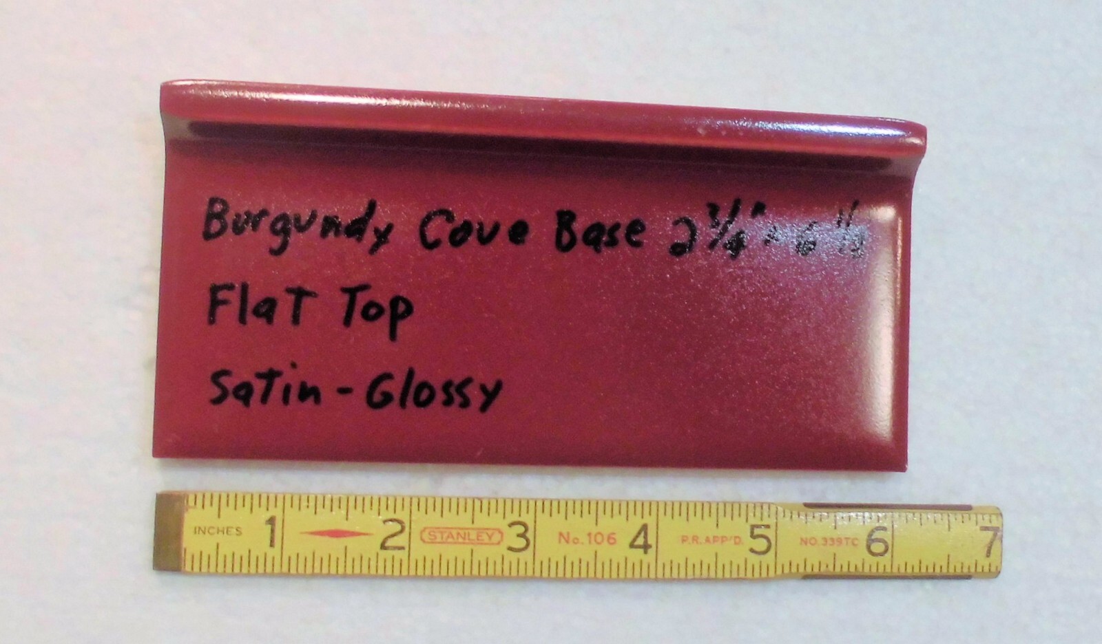 1 pc. Satin Gloss Burgundy: Flat Top base/cove Ceramic Tile: 2-3/4″ X 6-1/8″