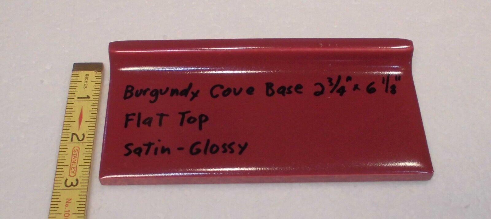 1 pc. Satin Gloss Burgundy: Flat Top base/cove Ceramic Tile: 2-3/4″ X 6-1/8″