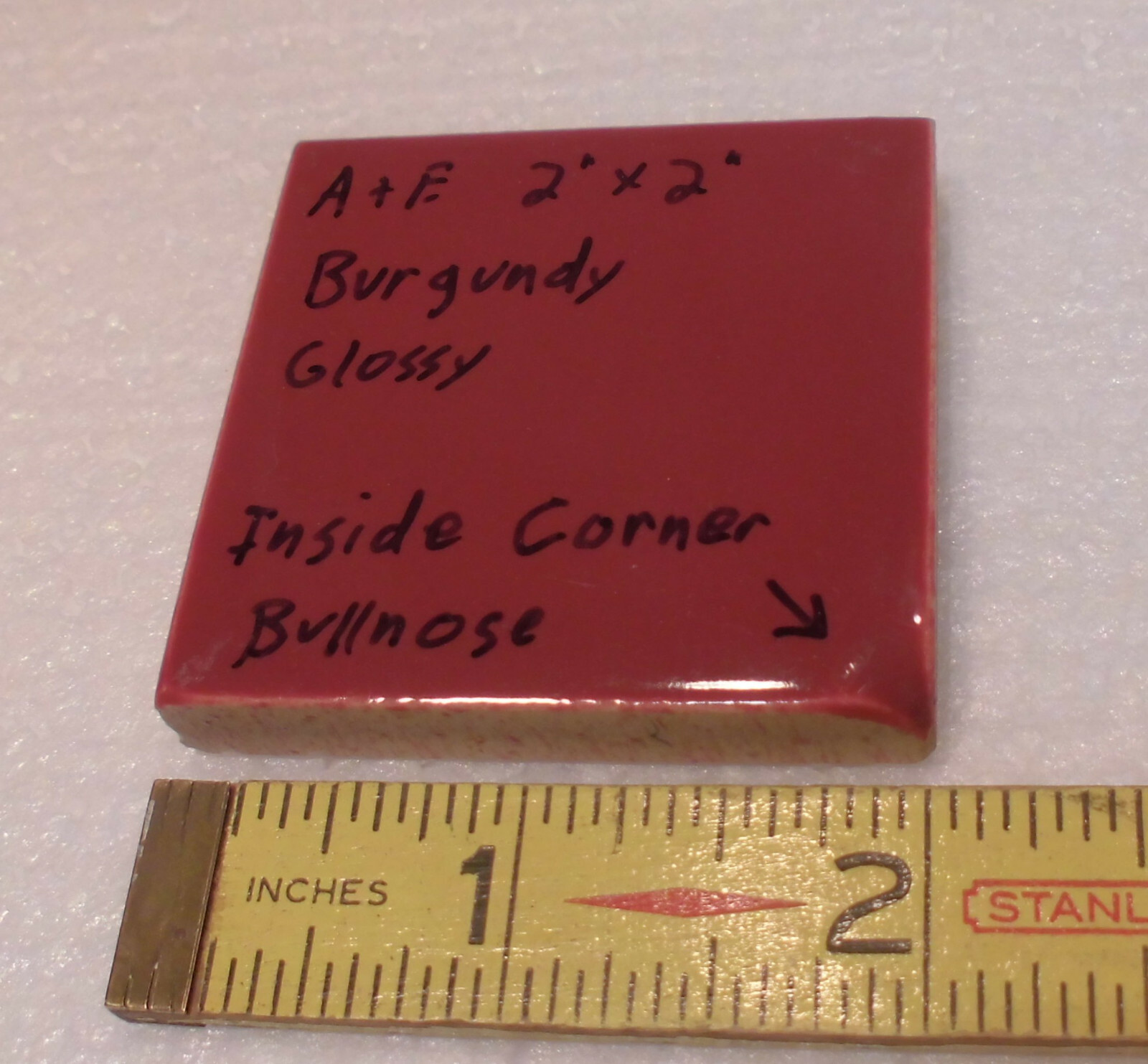 Burgundy 2″ X 2″ X 5/16″ Ceramic Surface Bullnose Inside Corner Tile; 1950’s