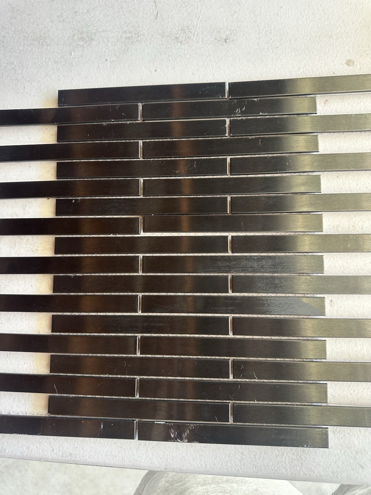 Black Aluminum Brushed Mosaic Tile .5×6 Inch On CeramicTile Backing Mesh Mounted