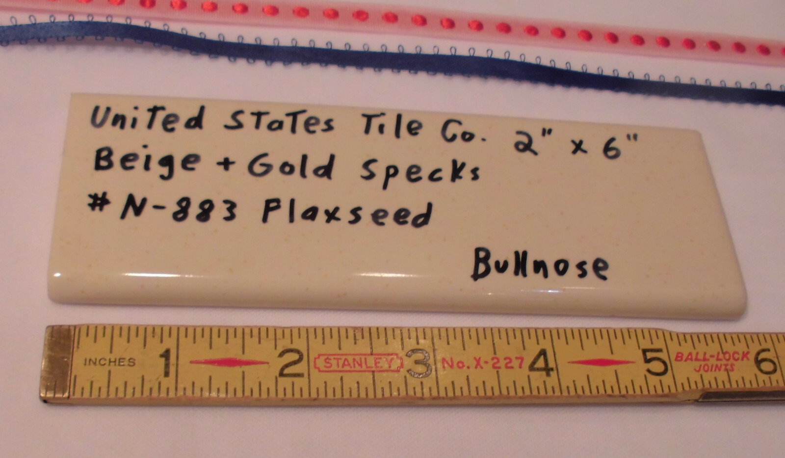 1 pc. Flaxseed / Beige + Gold Specks; Glossy Bullnose Surface Flat Ceramic Tile