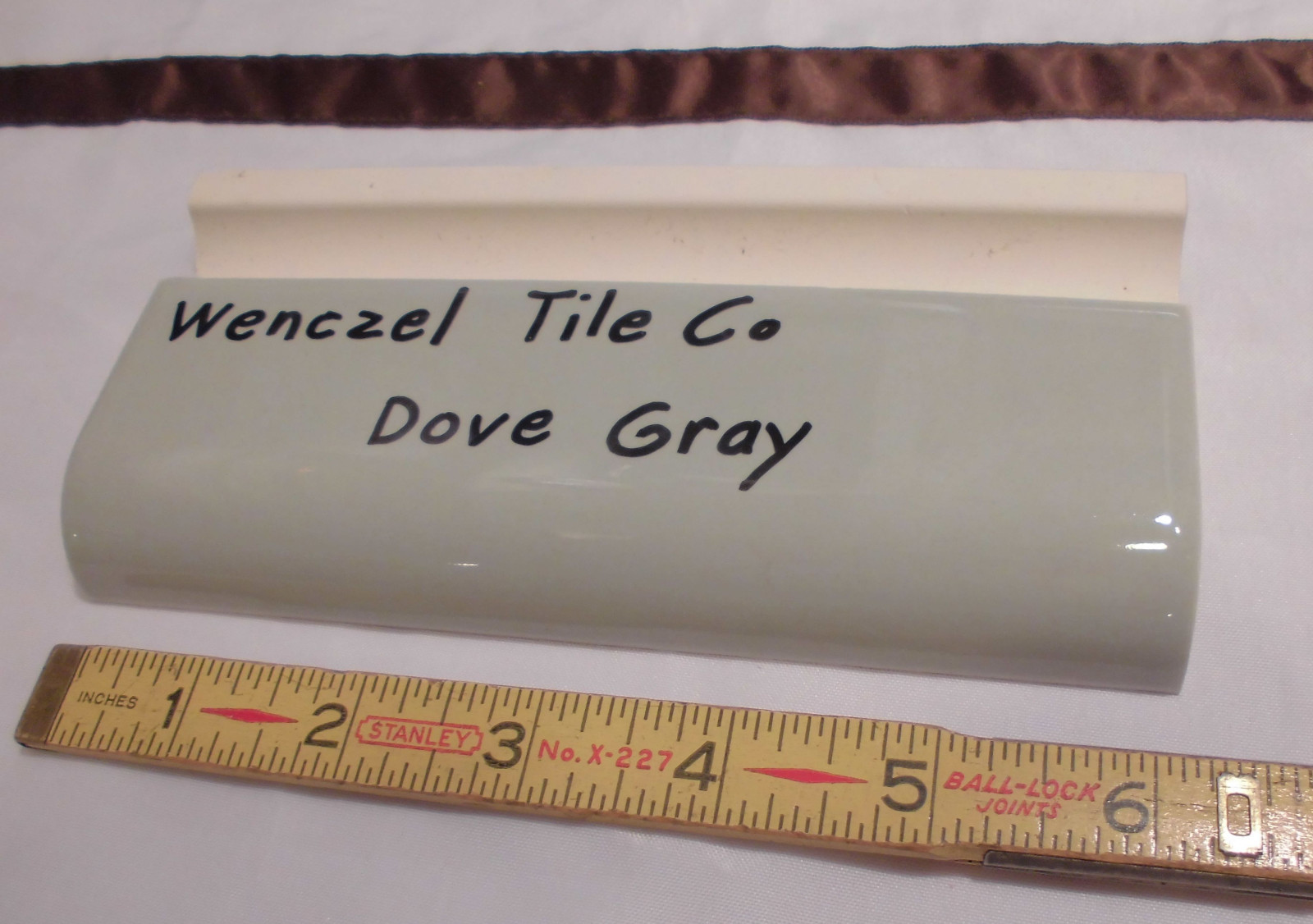 1 pc. Dove Gray: Glossy Ceramic Radius Bullnose Tile by Wenczel Co. 2″ X 6-1/4″