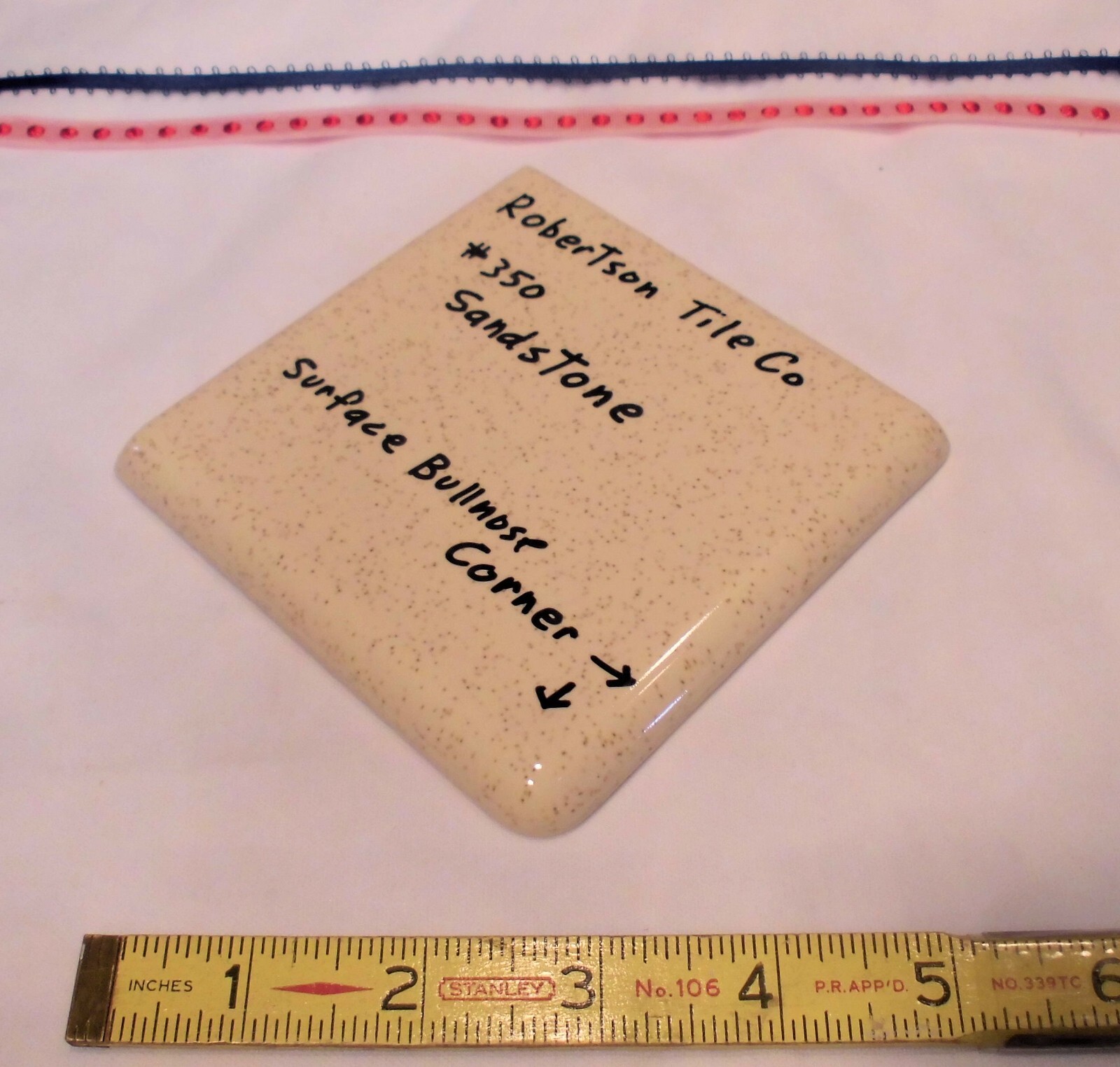 1 pc. Sandstone / Buckwheat: Glossy Ceramic Corner Bullnose Tile by Robertson Co