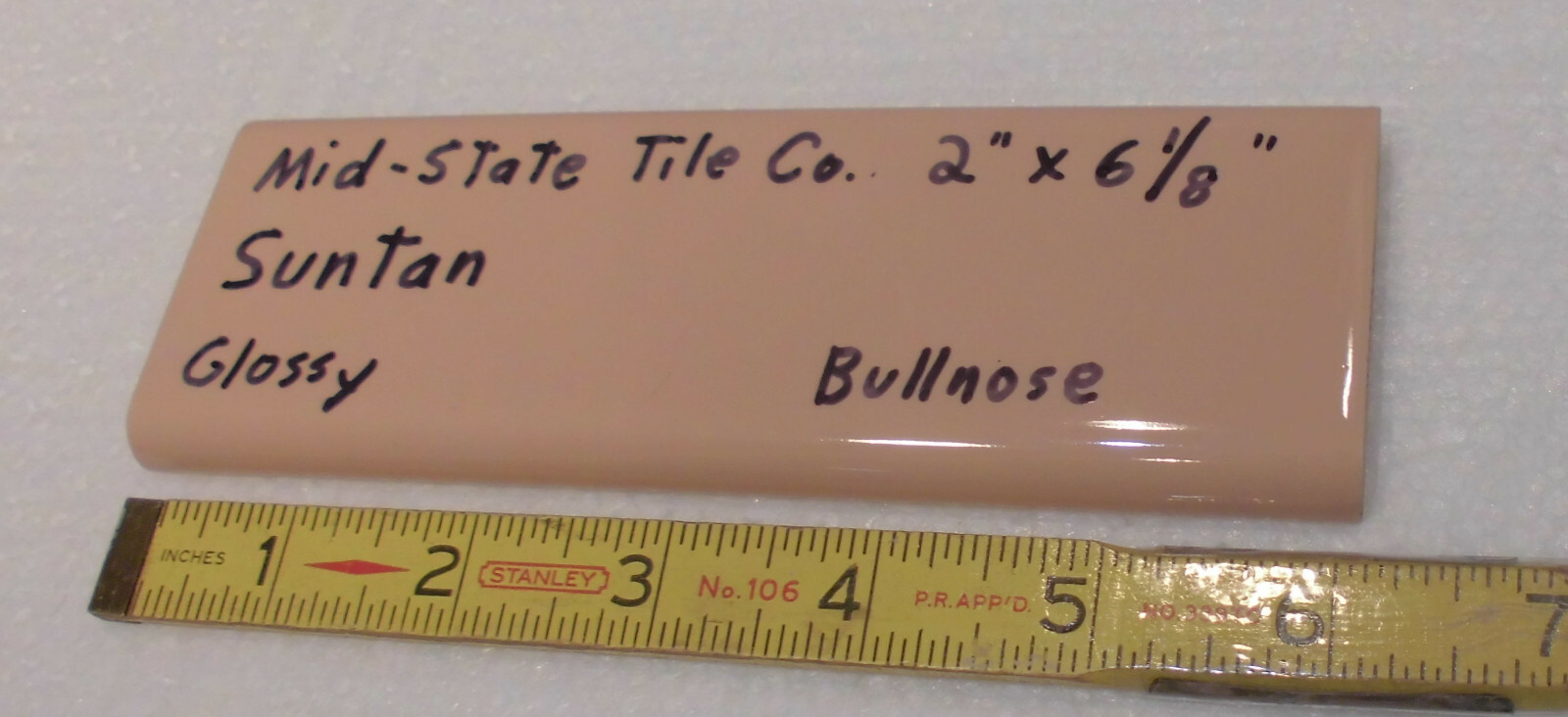 1 pc. Suntan-Beige 2” X 6” Glossy Ceramic Surface Bullnose tile by Mid-State Co.