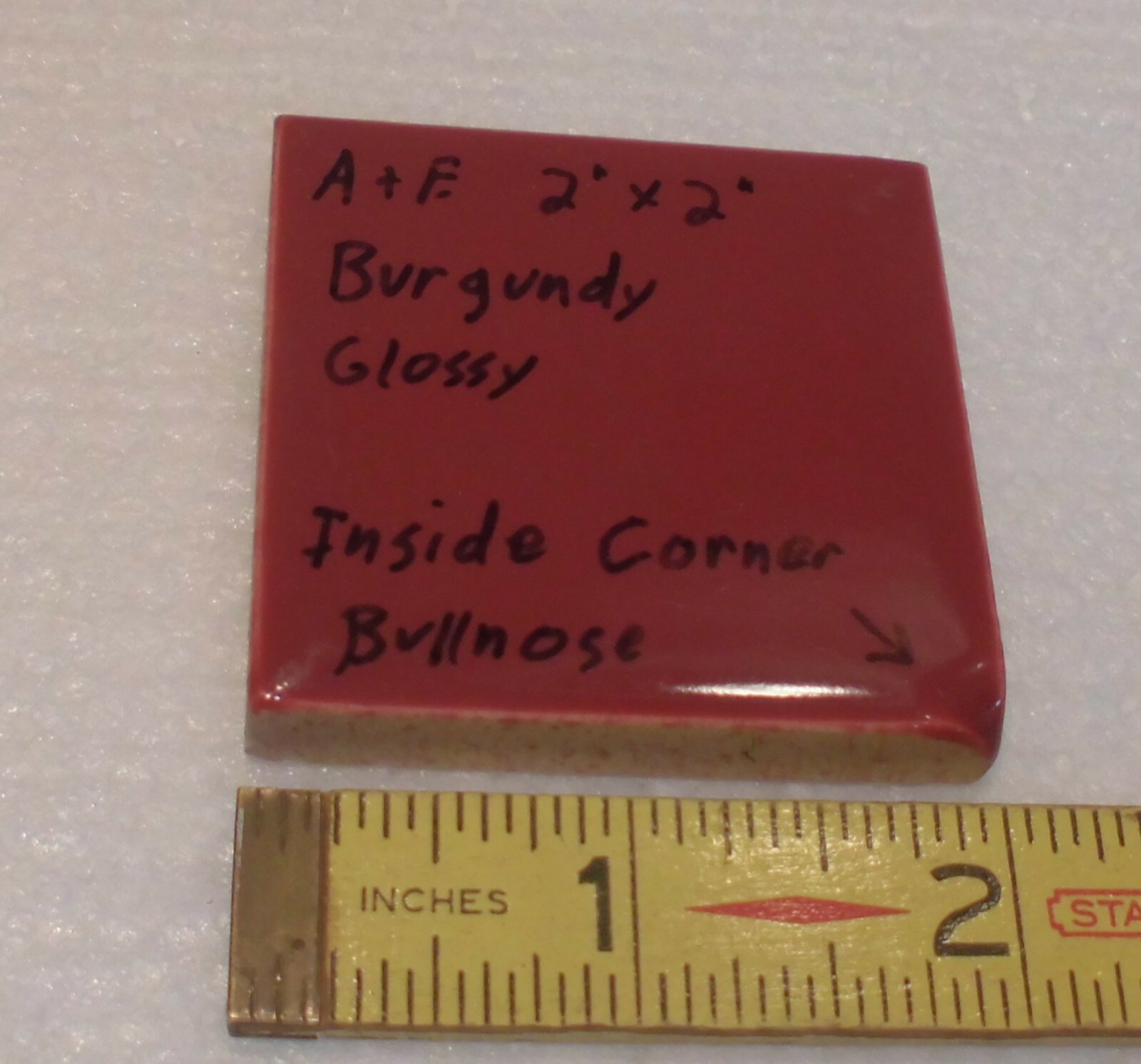 Burgundy 2″ X 2″ X 5/16″ Ceramic Surface Bullnose Inside Corner Tile; 1950’s