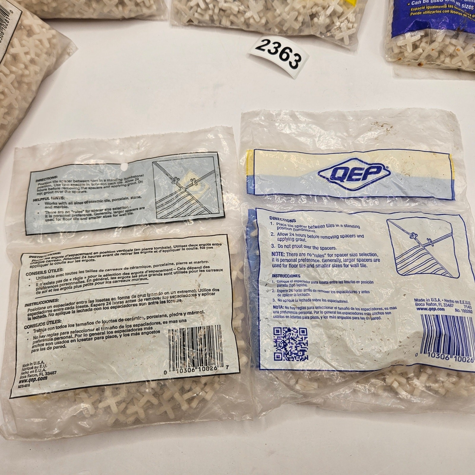 2300 COUNT LOT – QEB 1/8 IN TILE SPACERS NEW WITH 1 OPEN BAG CROSS FLEXIBLE