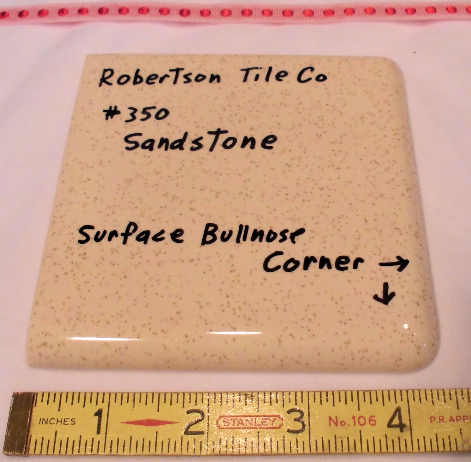 1 pc. Sandstone / Buckwheat: Glossy Ceramic Corner Bullnose Tile by Robertson Co