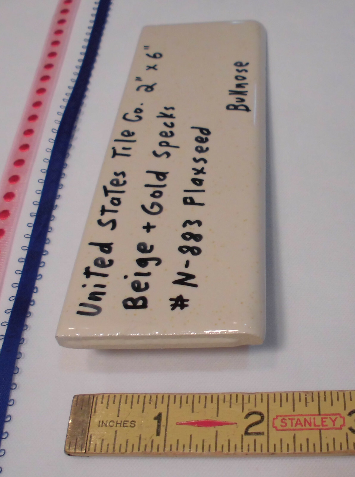 1 pc. Flaxseed / Beige + Gold Specks; Glossy Bullnose Surface Flat Ceramic Tile