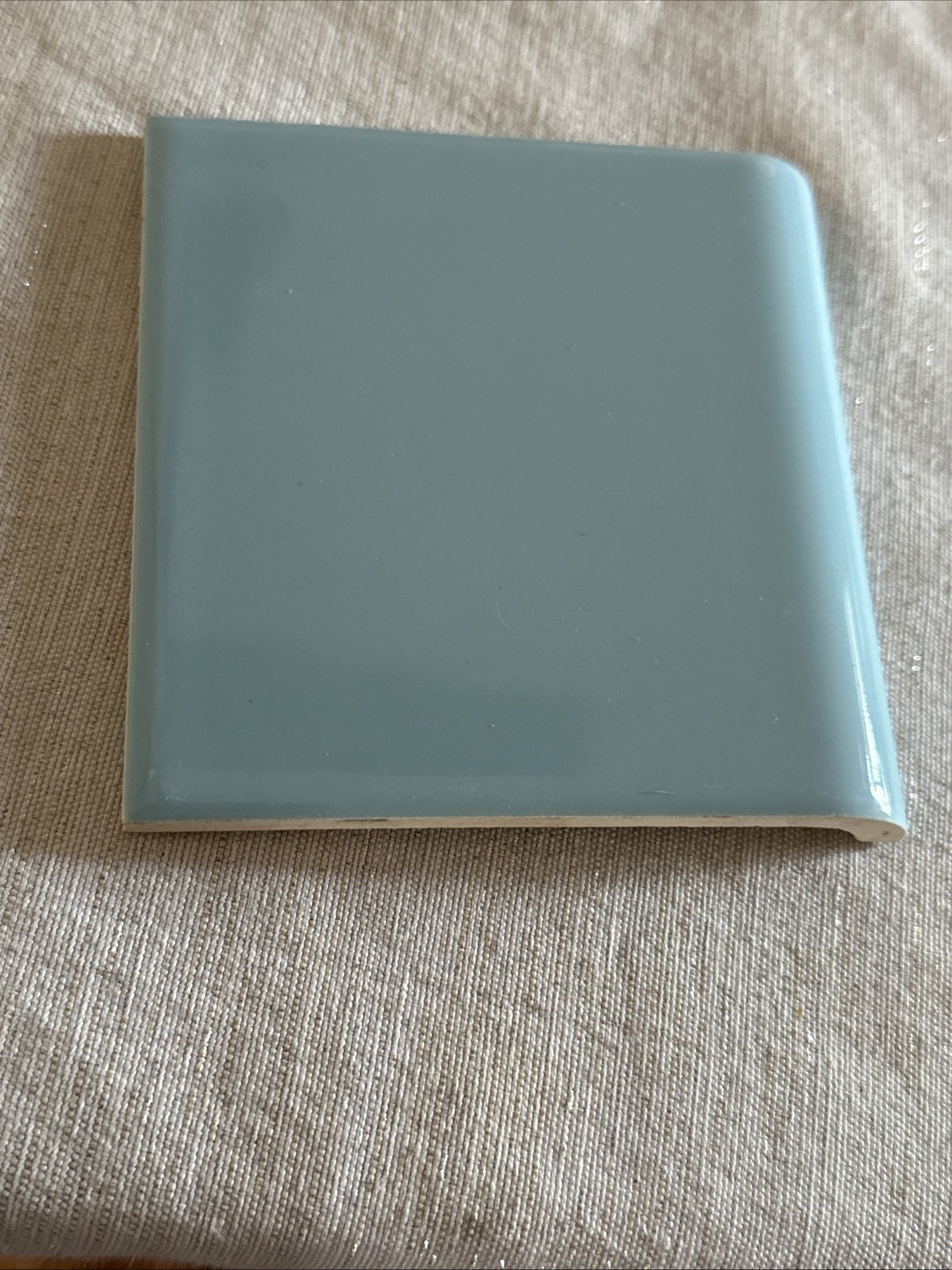 One 4 3/8 X 4 3/8 baby blue tile Bull Nose