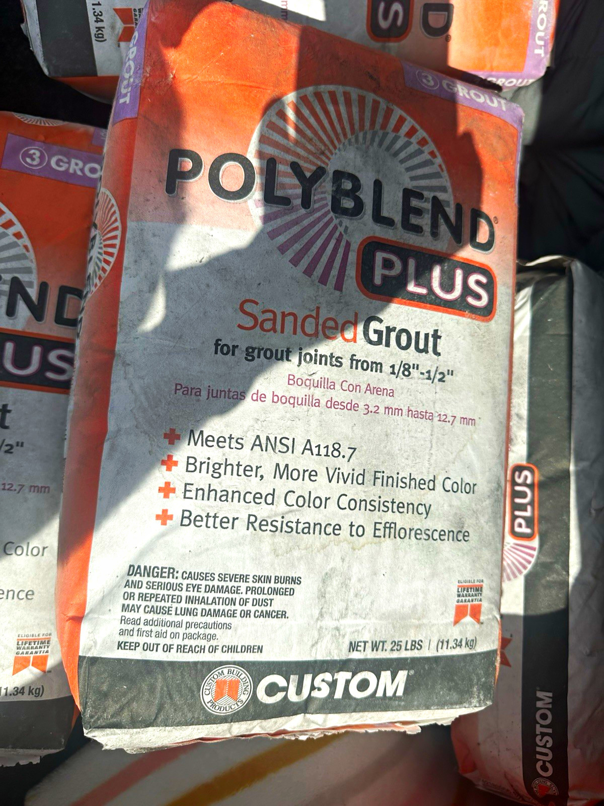 Poly Brand Polyblend Plus Sanded Grout 1/8″-1/2″ Joints 25 lb Gray/White/Orange