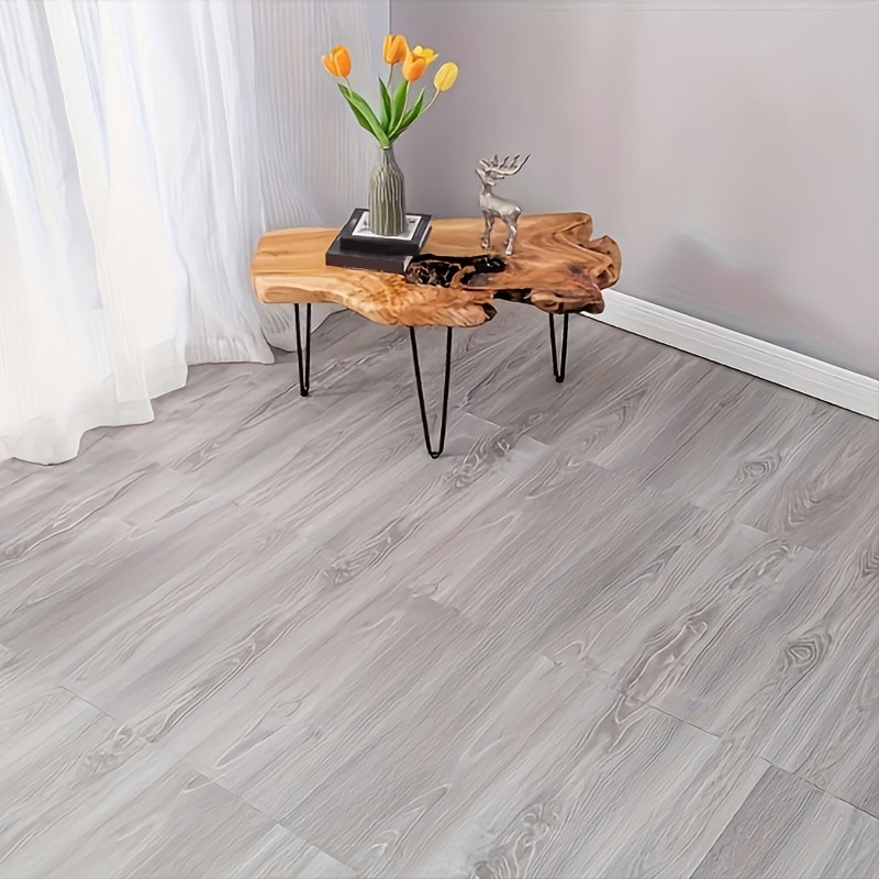 Luxury vinyl floor tiles, available in packs of 66 or 20, each measuring