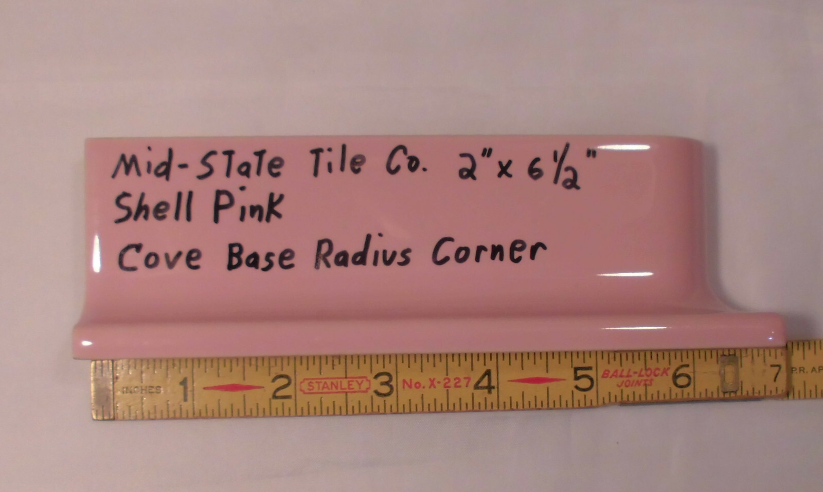 1 pc. Glossy Shell Pink 2” X 6-1/2” Ceramic Radius Cove Base Tile; Flat Top, R