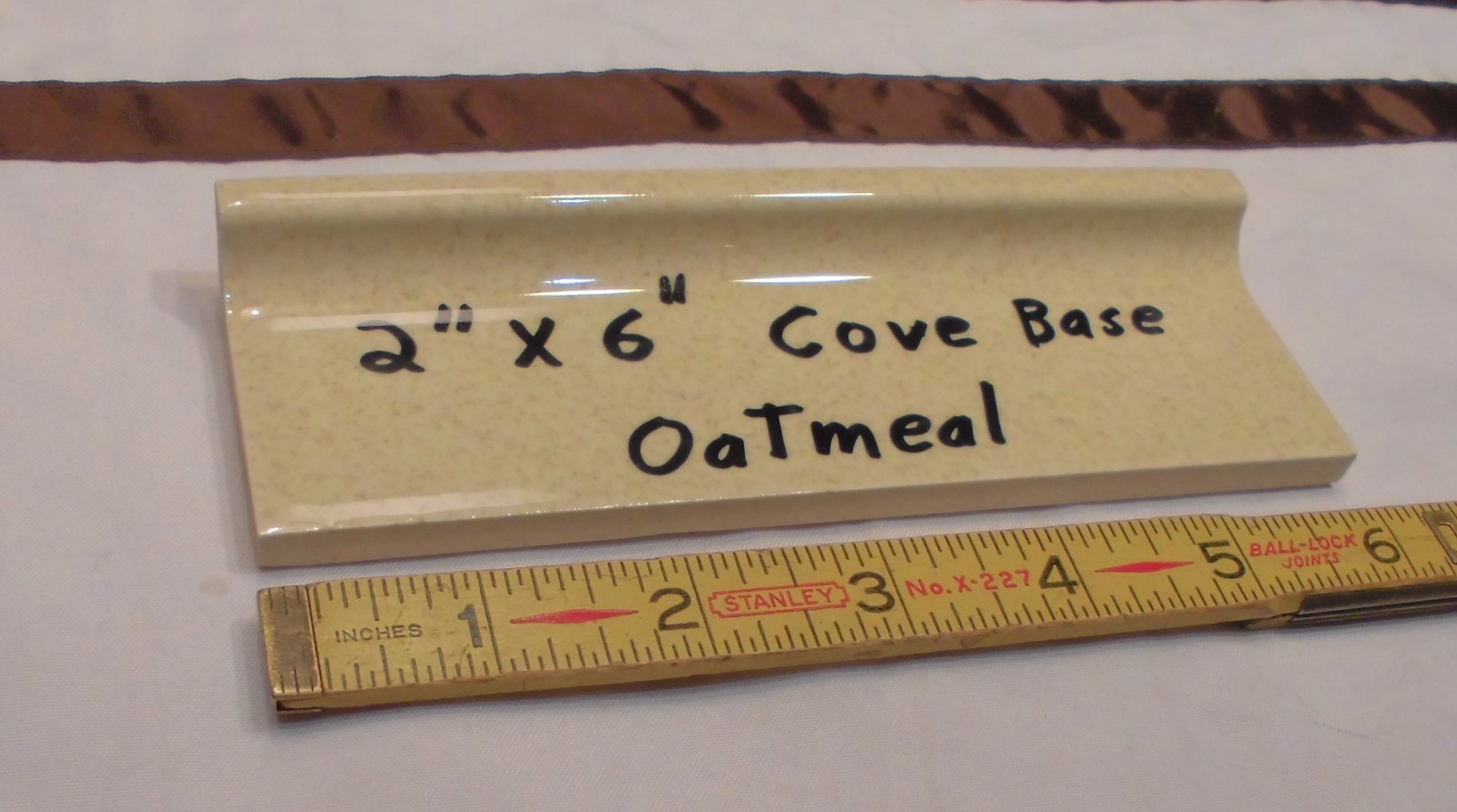 1 pc. Oatmeal – Yellow Speckled; stack-on-top base/cove Ceramic Tile 2″ X 6″