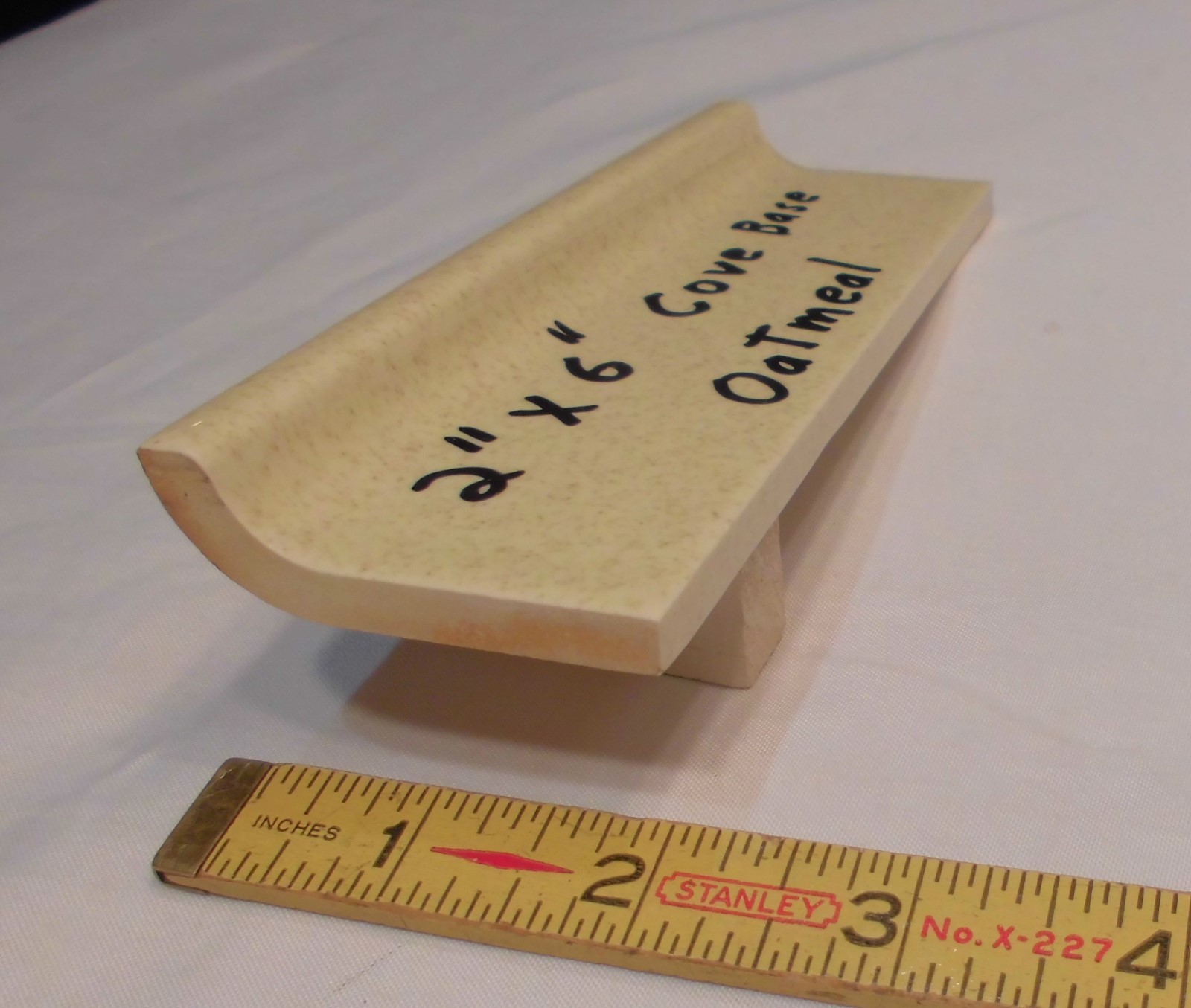 1 pc. Oatmeal – Yellow Speckled; stack-on-top base/cove Ceramic Tile 2″ X 6″