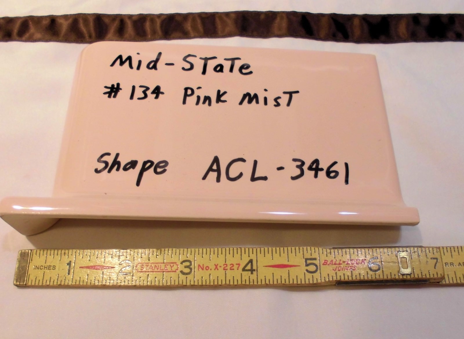 1 pc. Glossy *Pink Mist* 4” X 6” Ceramic Cove Base Outside Corner Tile-stack top