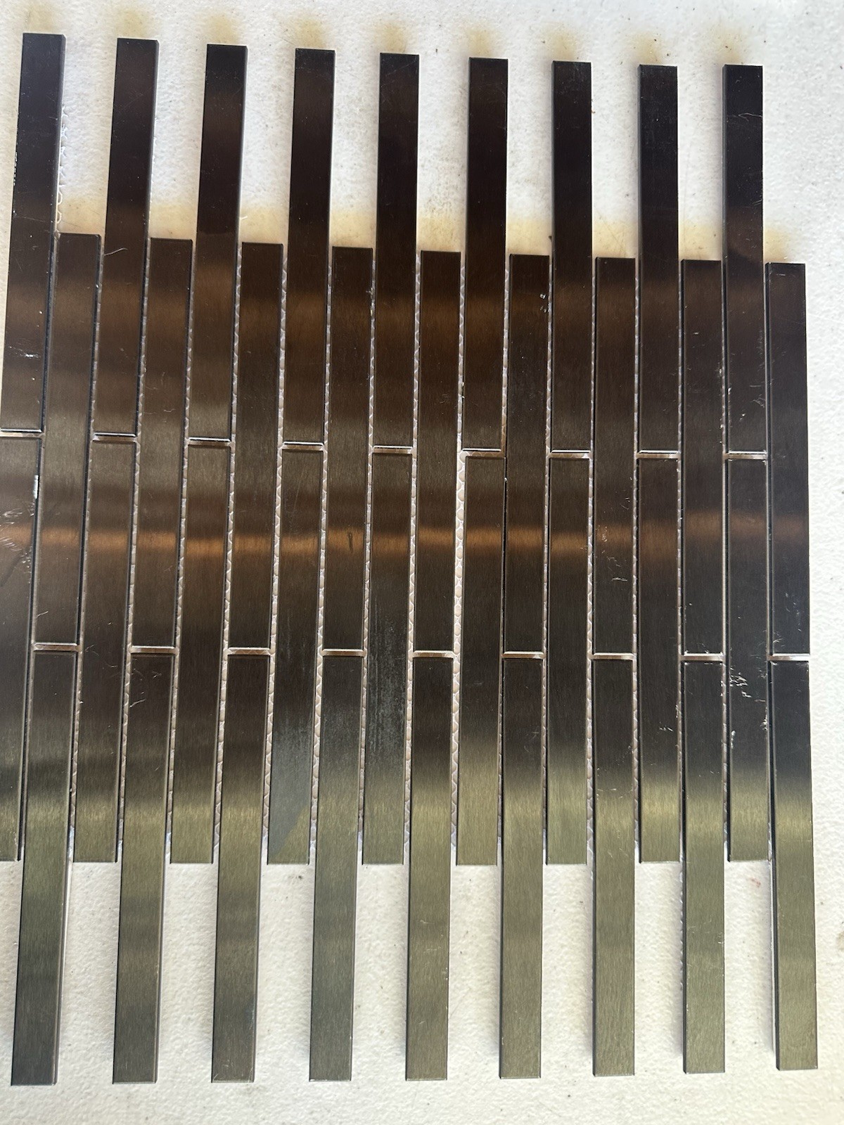 Black Aluminum Brushed Mosaic Tile .5×6 Inch On CeramicTile Backing Mesh Mounted