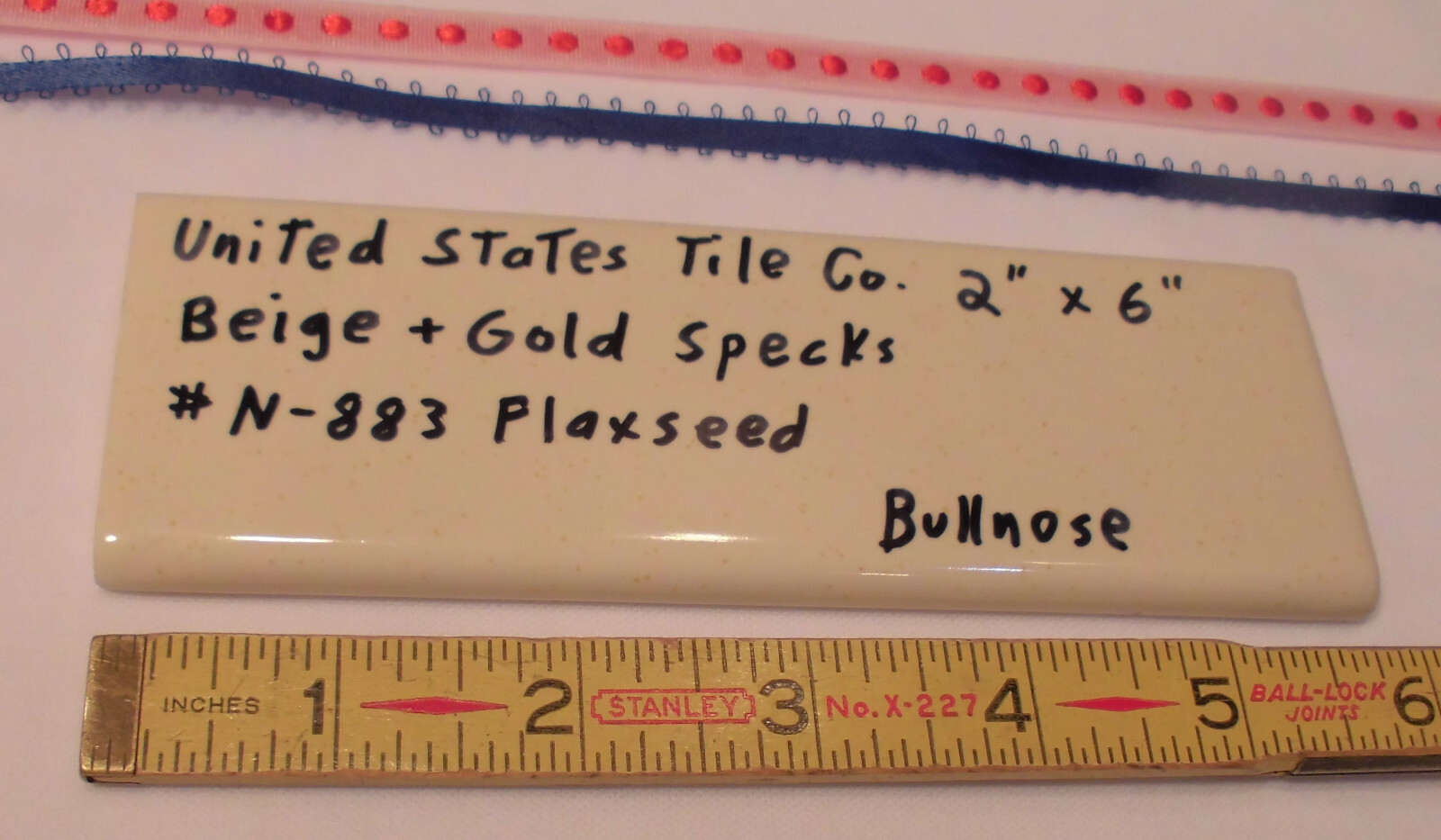 1 pc. Flaxseed / Beige + Gold Specks; Glossy Bullnose Surface Flat Ceramic Tile