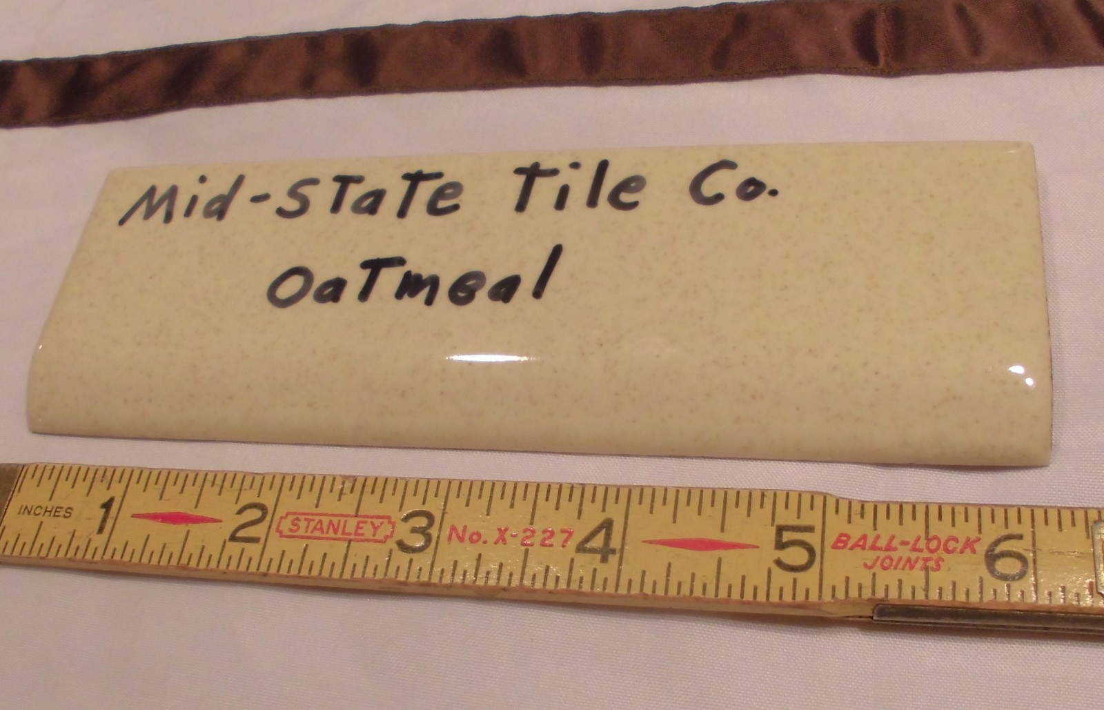1 pc. Glossy *Oatmeal: 2” X 6-1/8” Bullnose Surface Ceramic Tile by MID-STATE