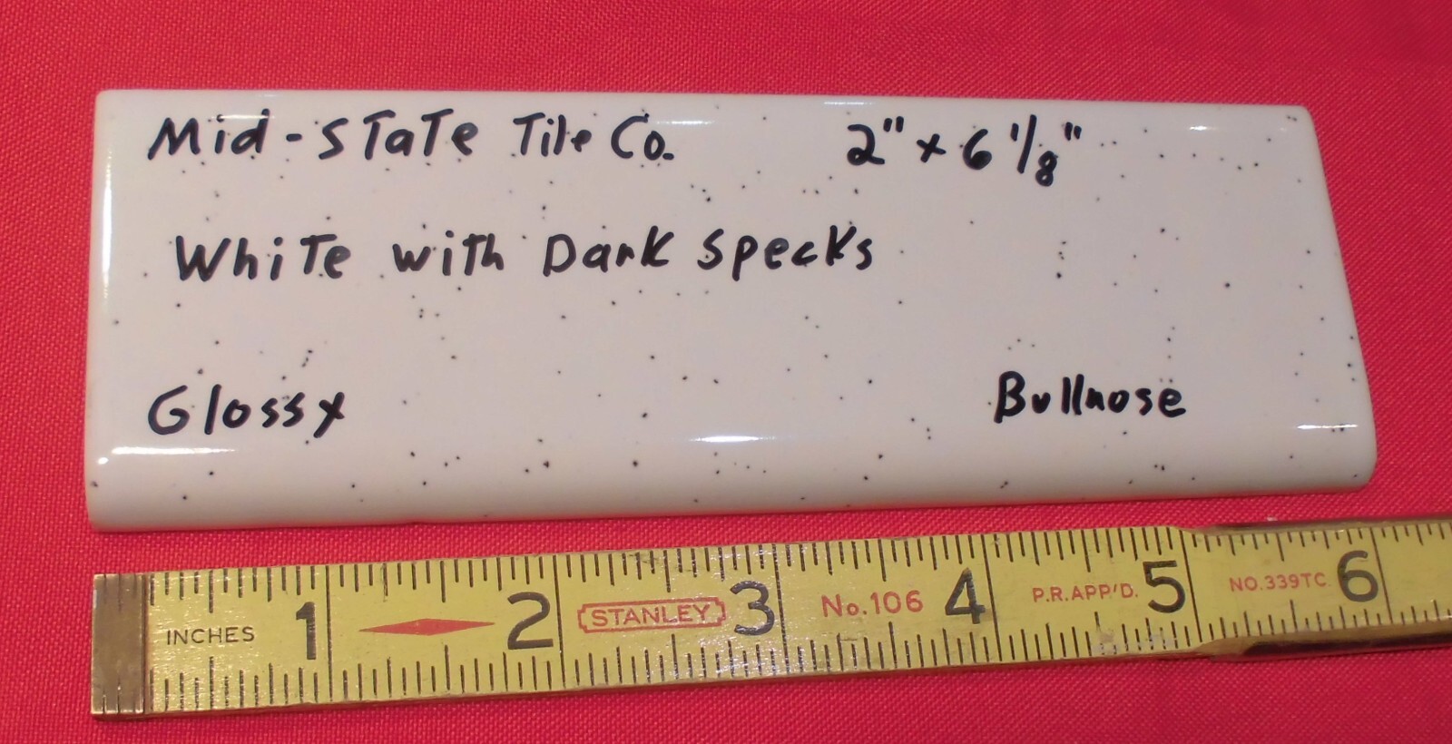 1 pc. White + Dark Specks: 2” X 6” Surface Bullnose Ceramic Tile by MID-STATE