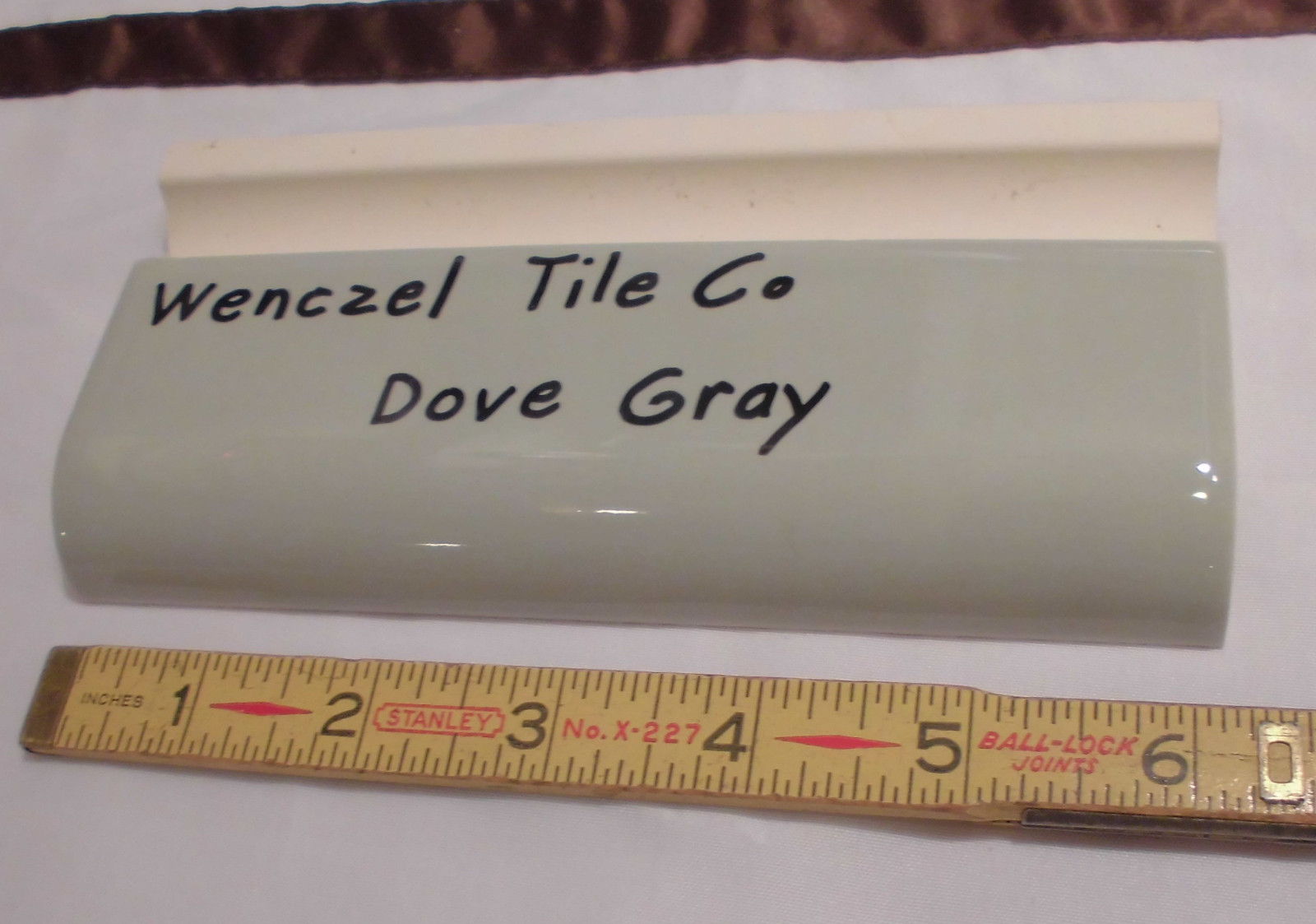 1 pc. Dove Gray: Glossy Ceramic Radius Bullnose Tile by Wenczel Co. 2″ X 6-1/4″