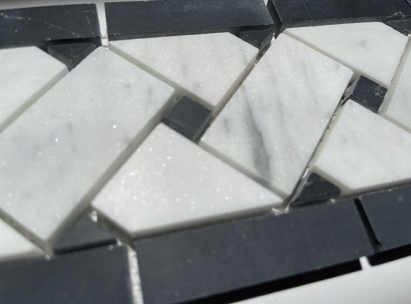 C651BXH Carrara Venato Marble Basketweave Mosaic Border 4×12 Black Dots Honed