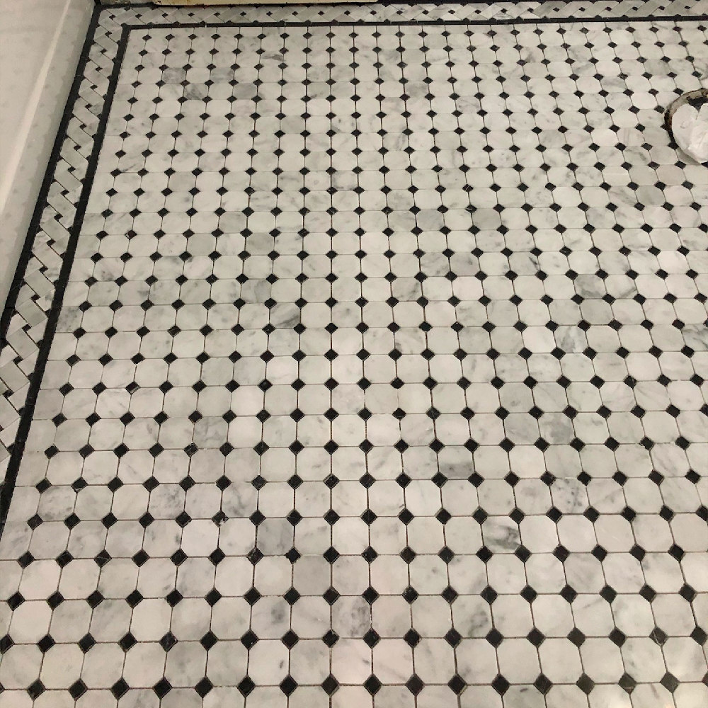 C651BXH Carrara Venato Marble Basketweave Mosaic Border 4×12 Black Dots Honed