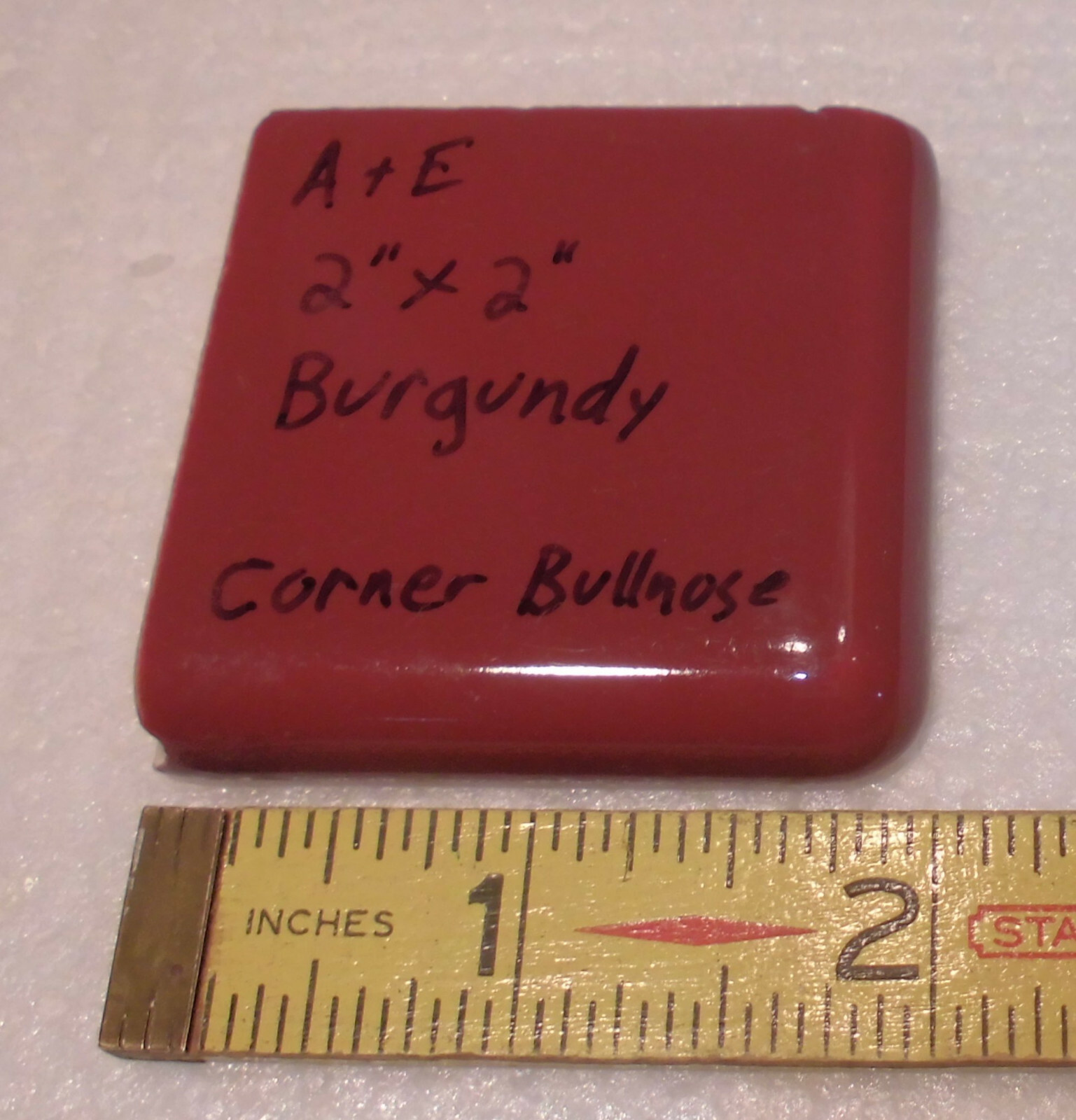Burgundy 2″ X 2″ X 5/16″ Ceramic Surface Bullnose Corner Tile; made 1940’s