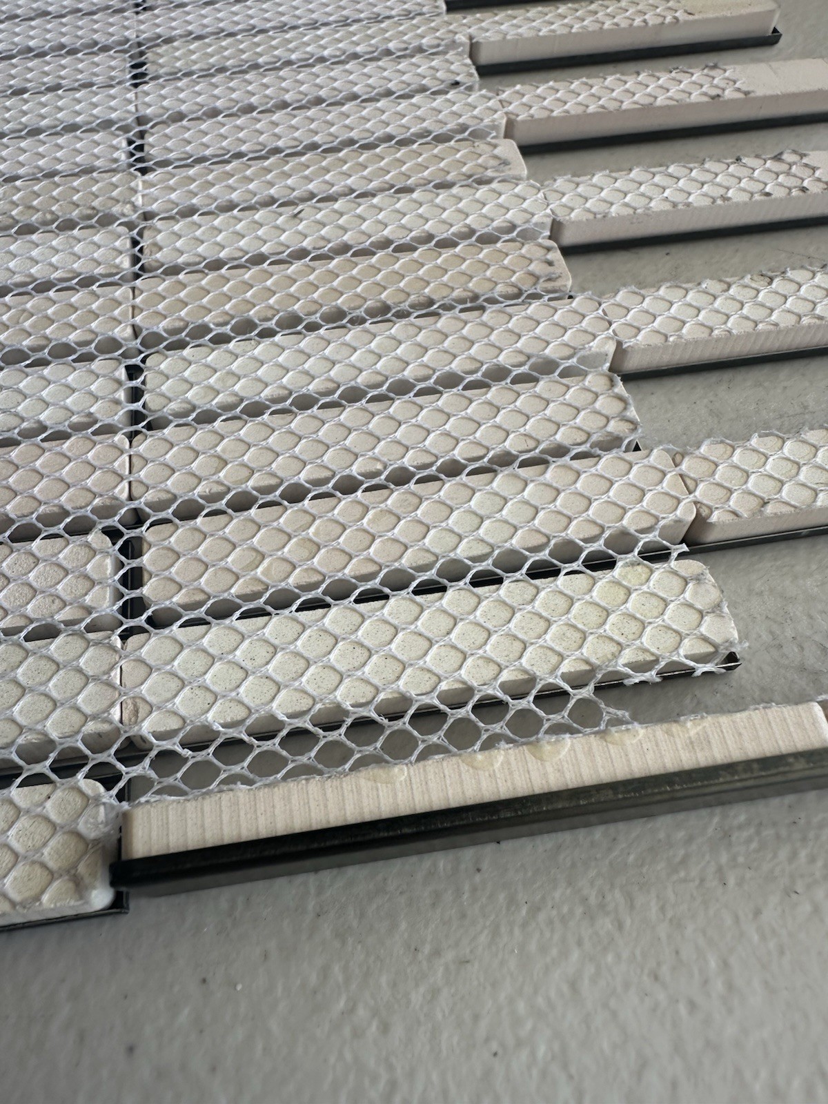 Black Aluminum Brushed Mosaic Tile .5×6 Inch On CeramicTile Backing Mesh Mounted