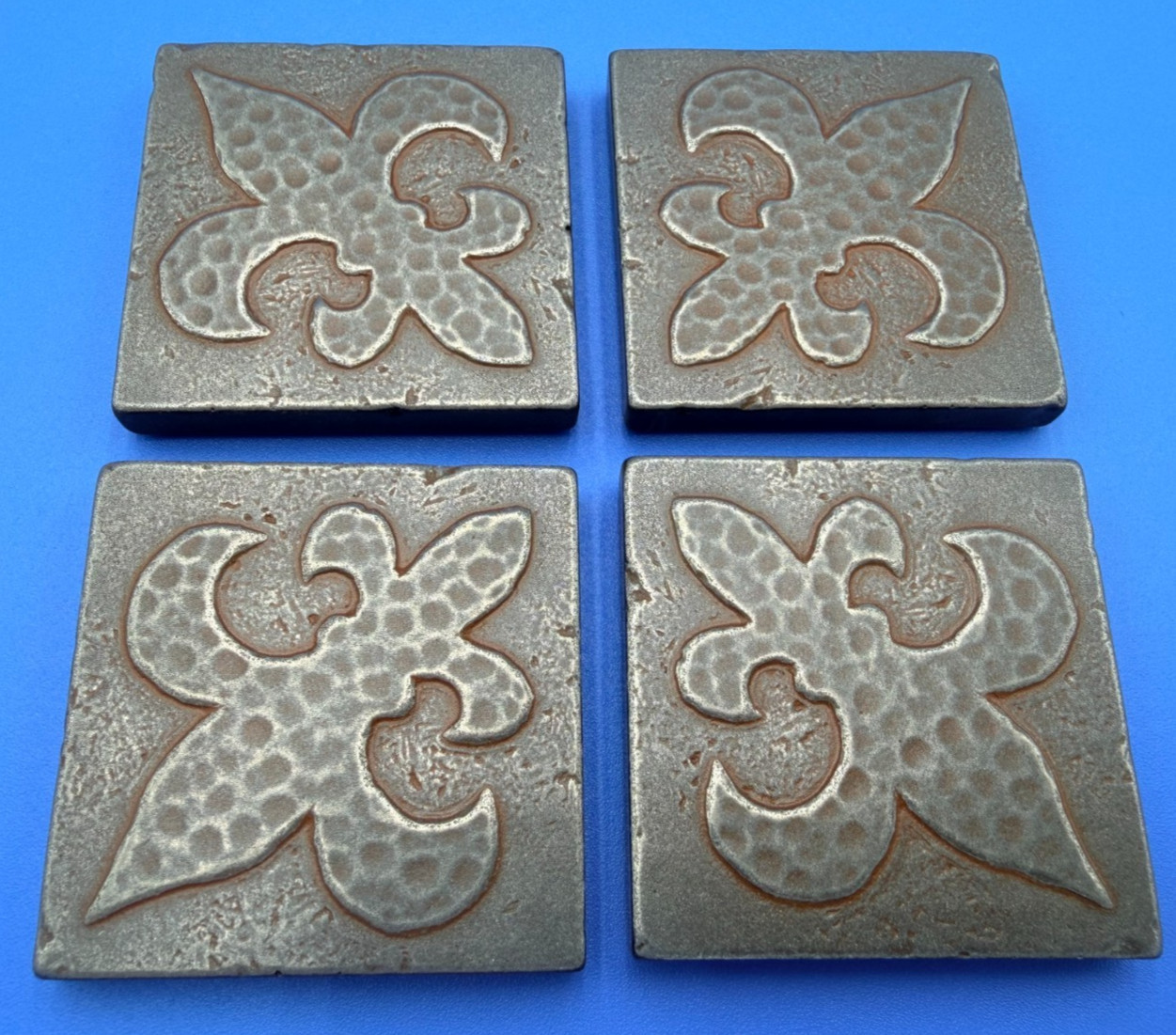New Questech 2×2 Fleur-de-lis Insert Accent Composite Tile w/ Aged Iron Finish