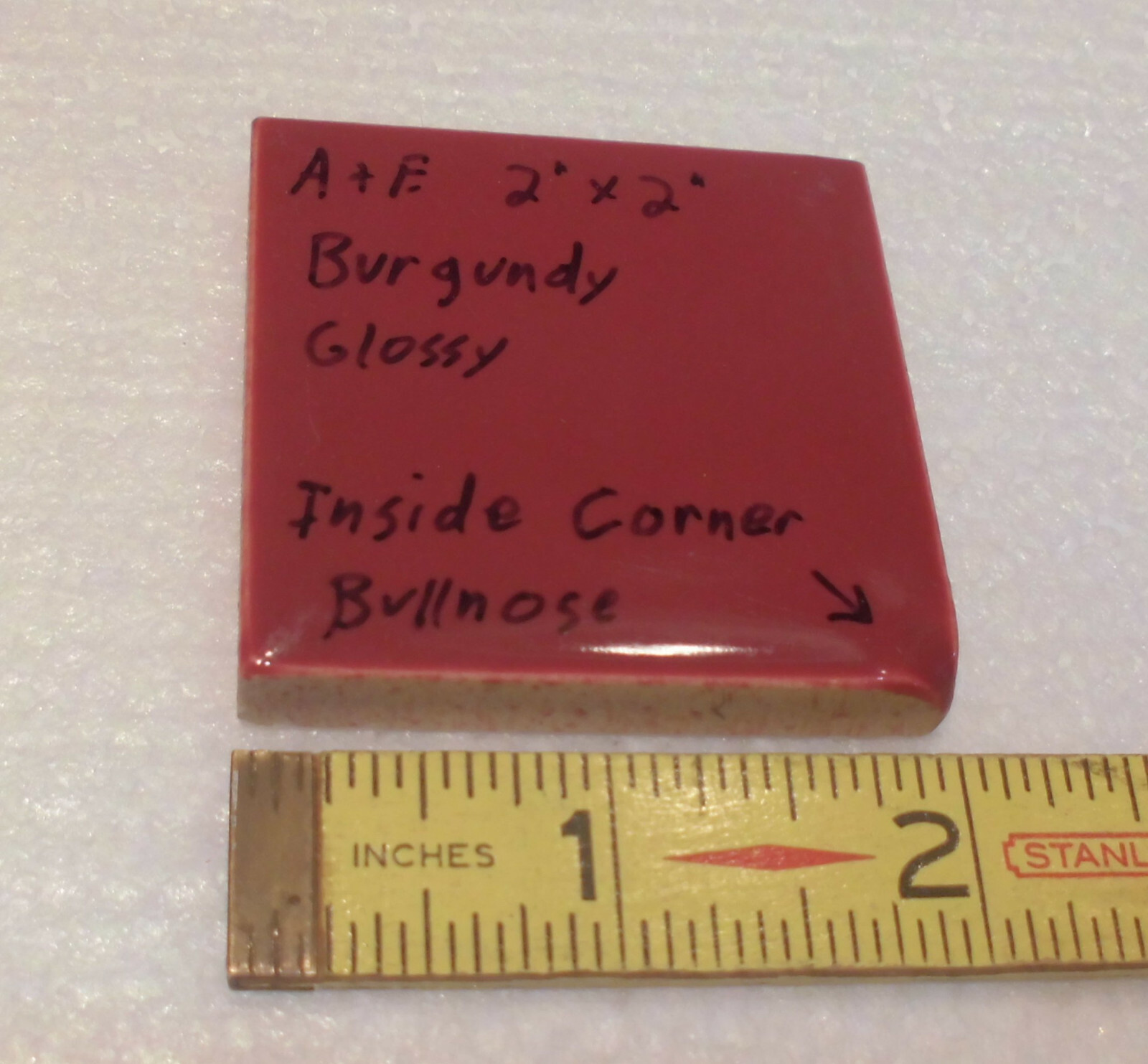 Burgundy 2″ X 2″ X 5/16″ Ceramic Surface Bullnose Inside Corner Tile; 1950’s