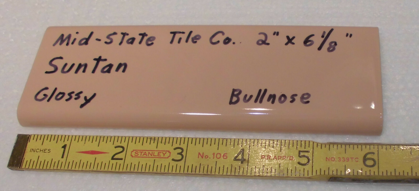 1 pc. Suntan-Beige 2” X 6” Glossy Ceramic Surface Bullnose tile by Mid-State Co.